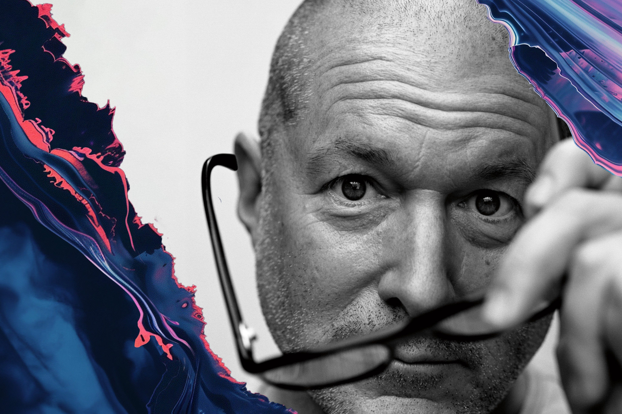 Jony Ive, in black-and-white, holds his glasses in front of his face and stares directly into the camera.