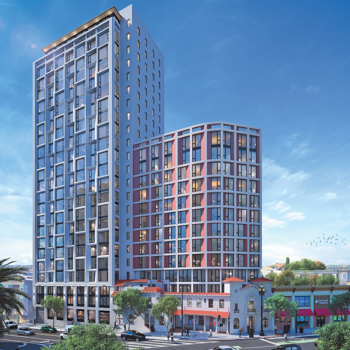 The image shows two modern, high-rise buildings with many windows, adjacent to a traditional, colorful low-rise structure on a busy street lined with trees and parked cars.