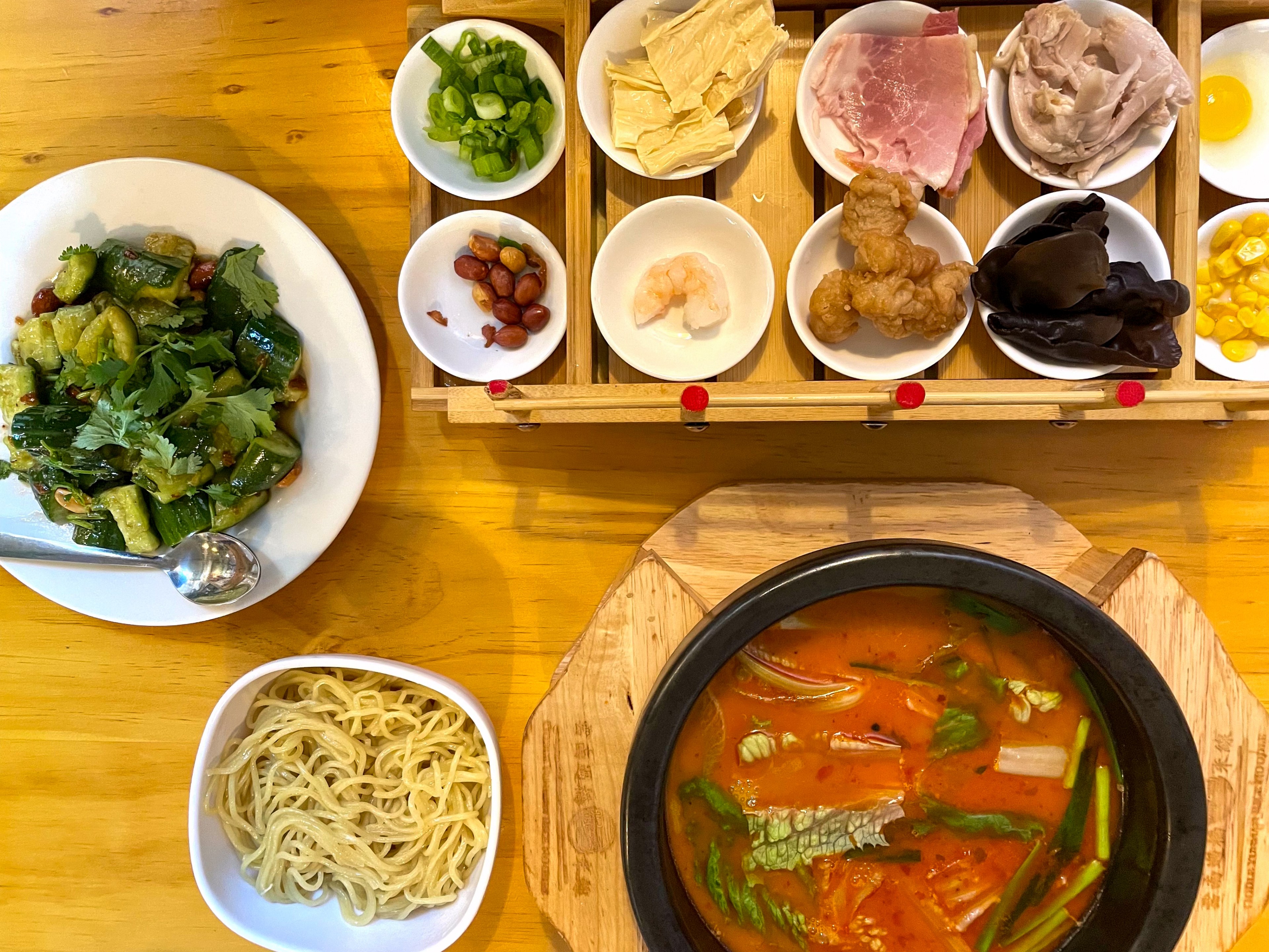 Oodle introduces Yunaan bridge noodles to the Outer Richmond. Little Pot Rice Noodles has a mildly spicy, chili oil-slicked broth and a bridge of ingredients to cook up.