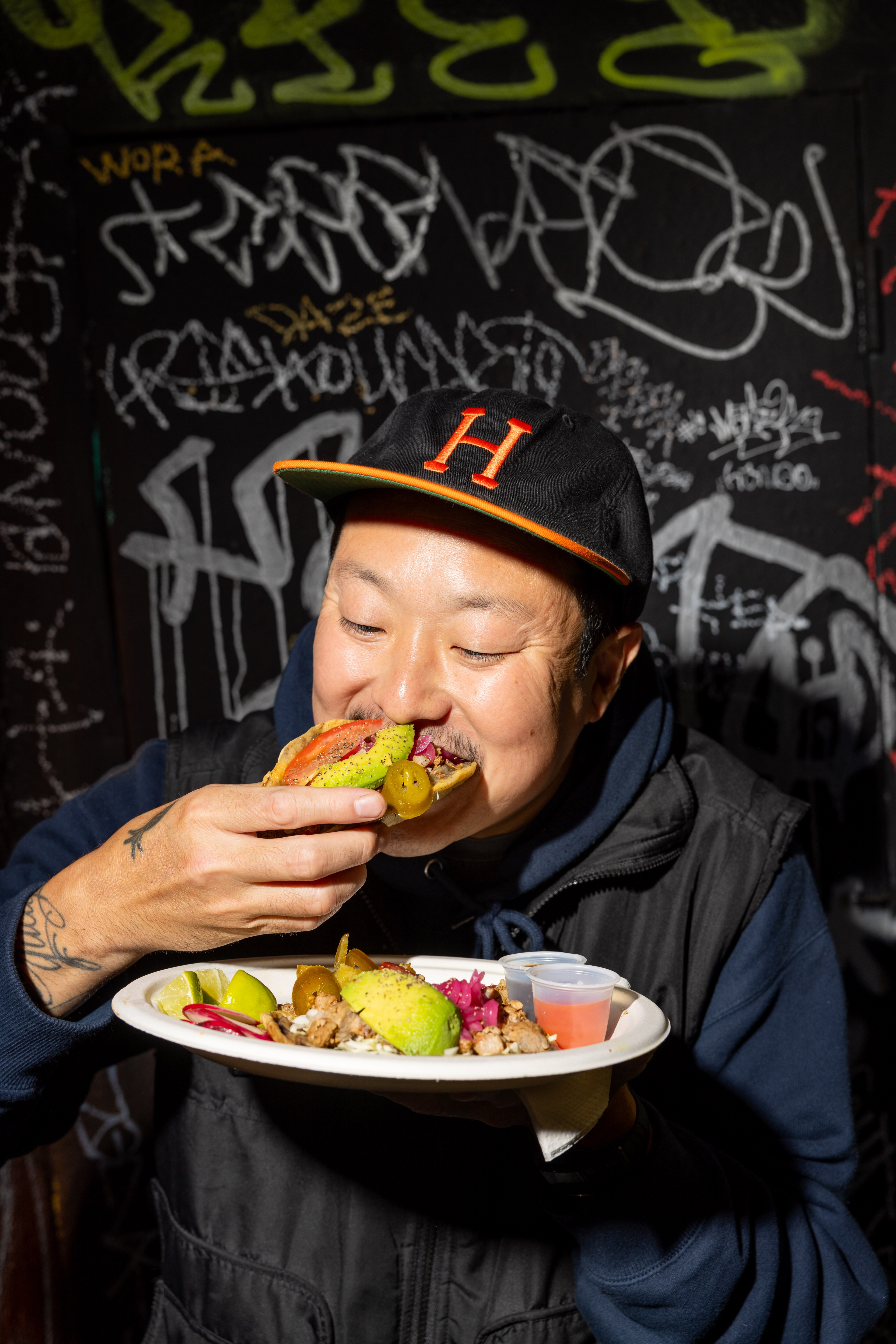 Chef Eric Ehler eats Pic Chuc from Tacos King Maya in the the Mission District of San Francisco on Friday, Aug. 9, 2024.