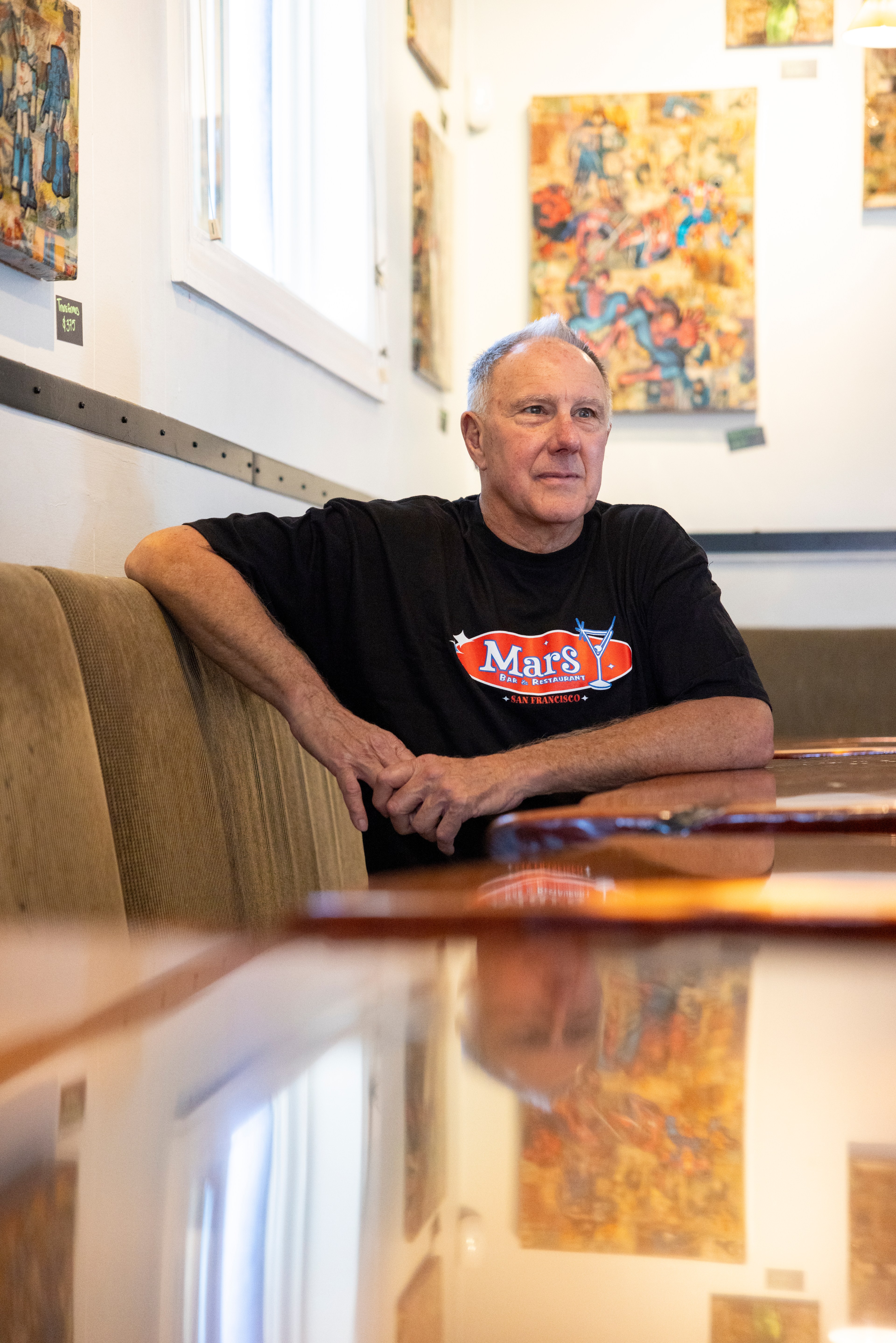 A man sits in a bar.