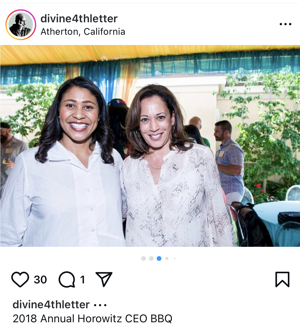 Two women, smiling, stand arm-in-arm at a cheerful outdoor event with people and greenery visible in the background. The Instagram post mentions a 2018 BBQ event.