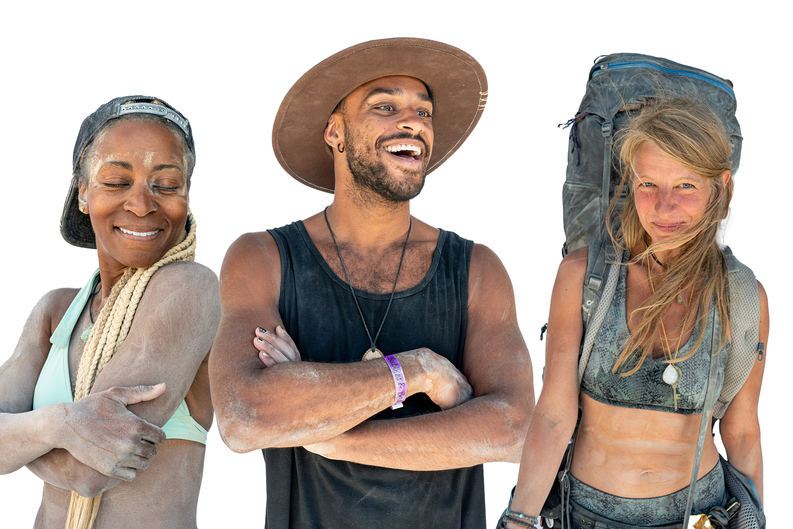 Three people are standing together, smiling. The woman on the left has blonde braids and is wearing a cap, the man in the middle is wearing a wide-brimmed hat, and the woman on the right has a backpack.