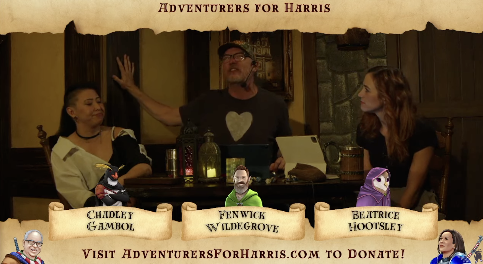 Three people sit at a table with microphones, candles, and various objects in a medieval-style room. The banner reads “Adventurers for Harris,&quot; with character names below.