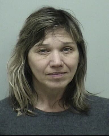 A woman with dirty blond hair is looking directly into the camera for a mugshot.