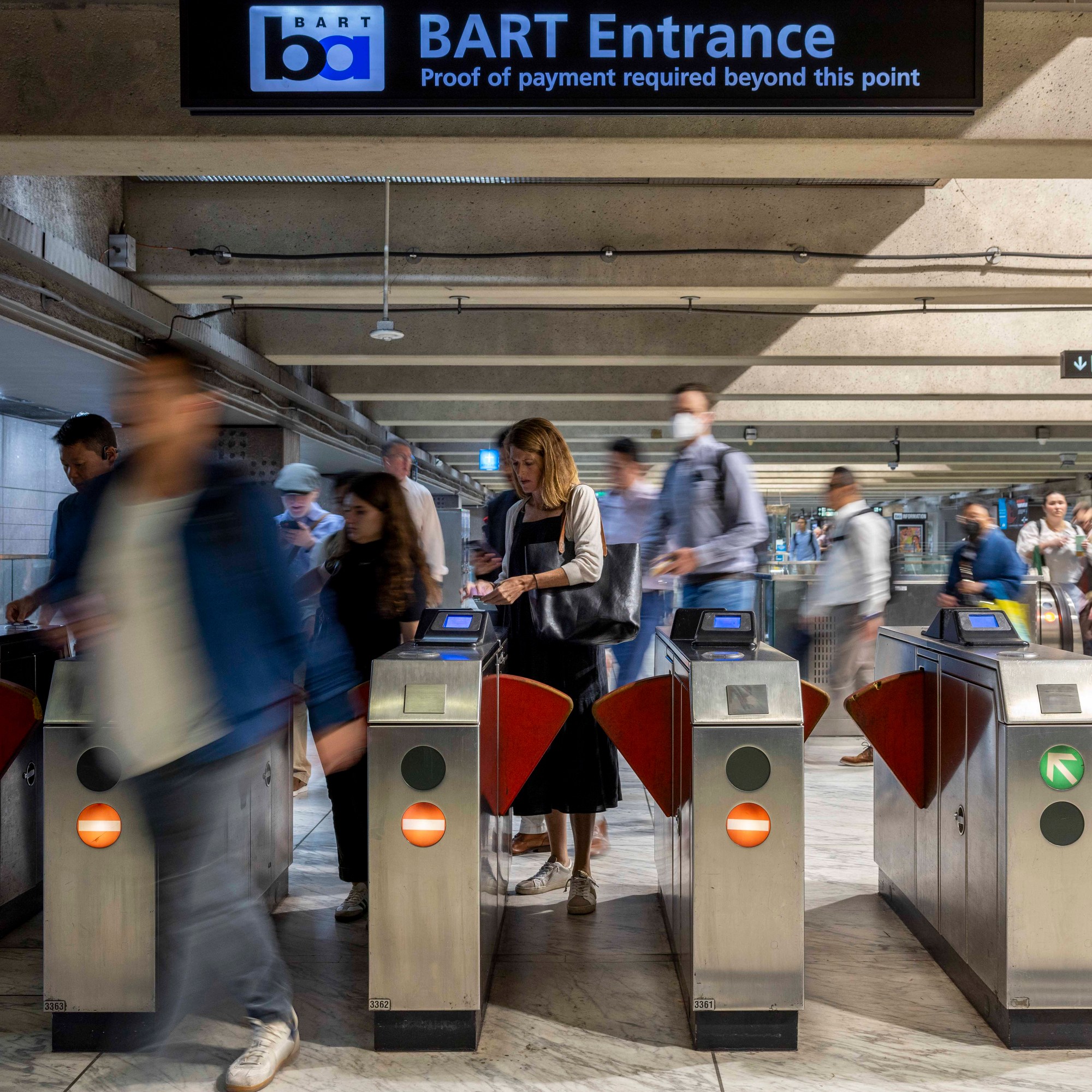 People exit the Embarcadero BART station in San Francisco.
