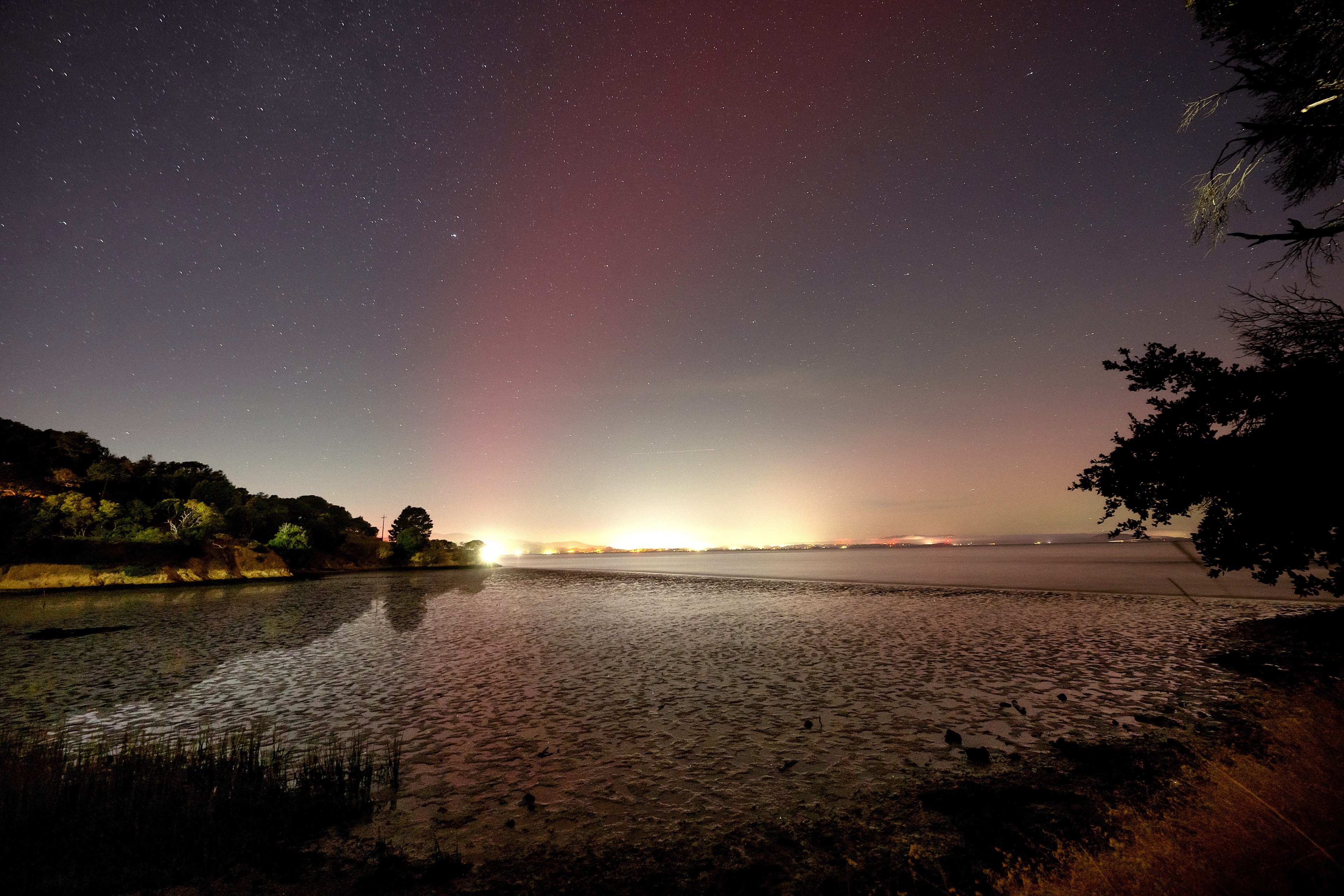 Seen from China Camp State Park, the northern lights glow over Marin County on Thursday, Oct. 10, 2024.