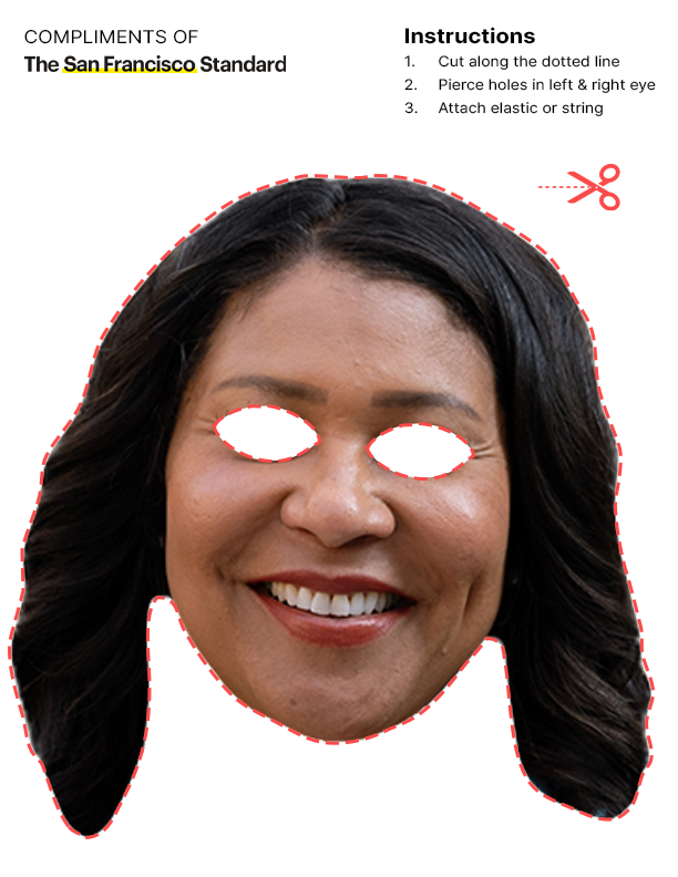 A cut-out mask of a smiling person’s face with eye holes, outlined with red dashes, alongside instructions for assembly from &quot;The San Francisco Standard.&quot;