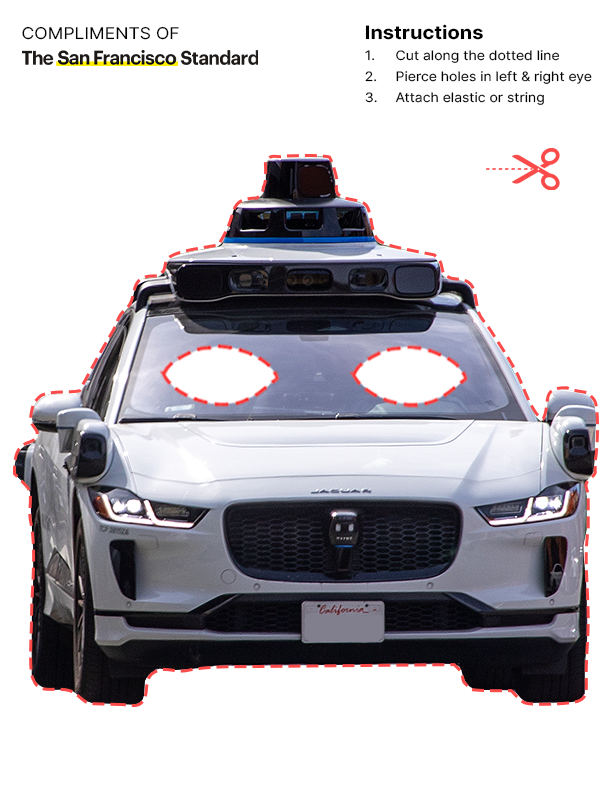 A white self-driving car with cut-out eye holes on the windshield is outlined for a mask. Instructions on the side explain how to make the mask.