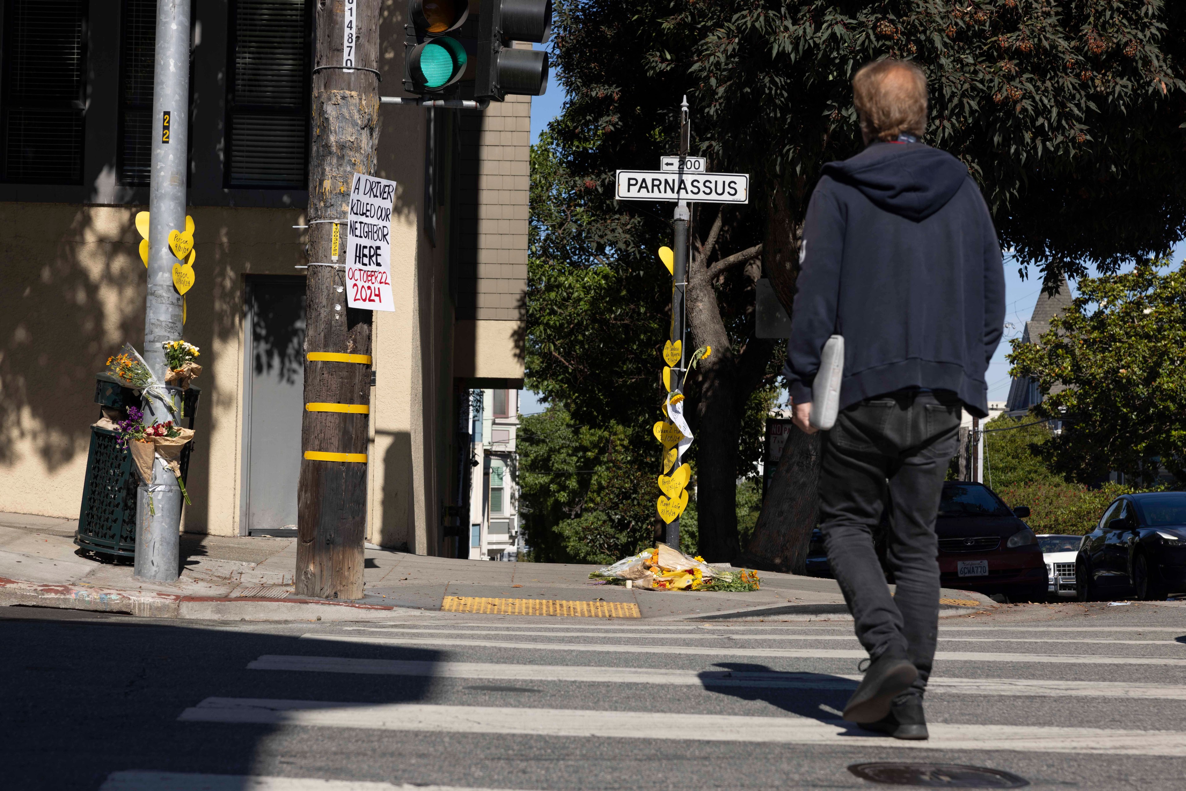 Man crosses Parnassus Avenue