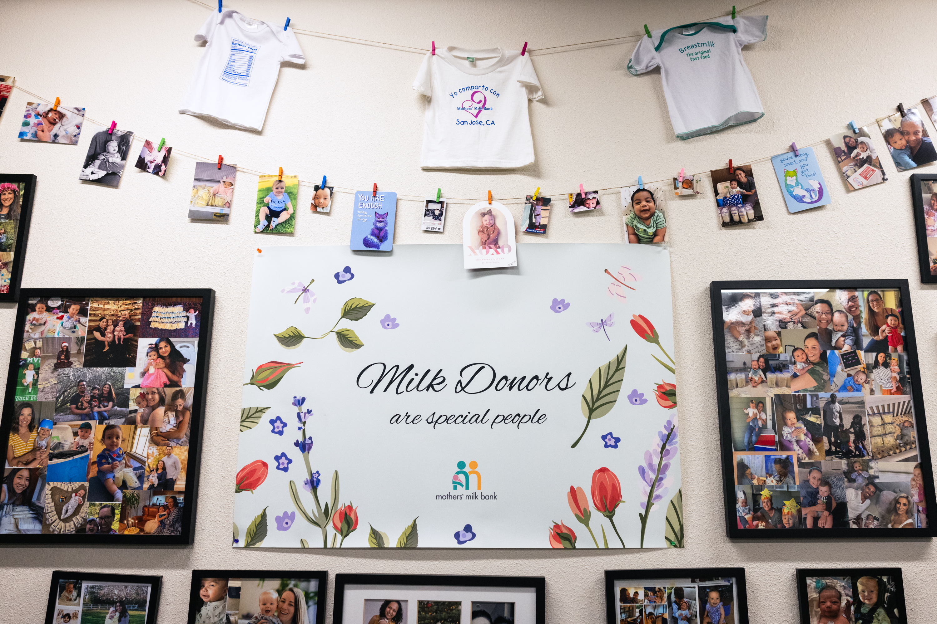 The image features framed photos of families, a central sign saying &quot;Milk Donors are special people,&quot; and baby clothes hanging on a line with more photos.