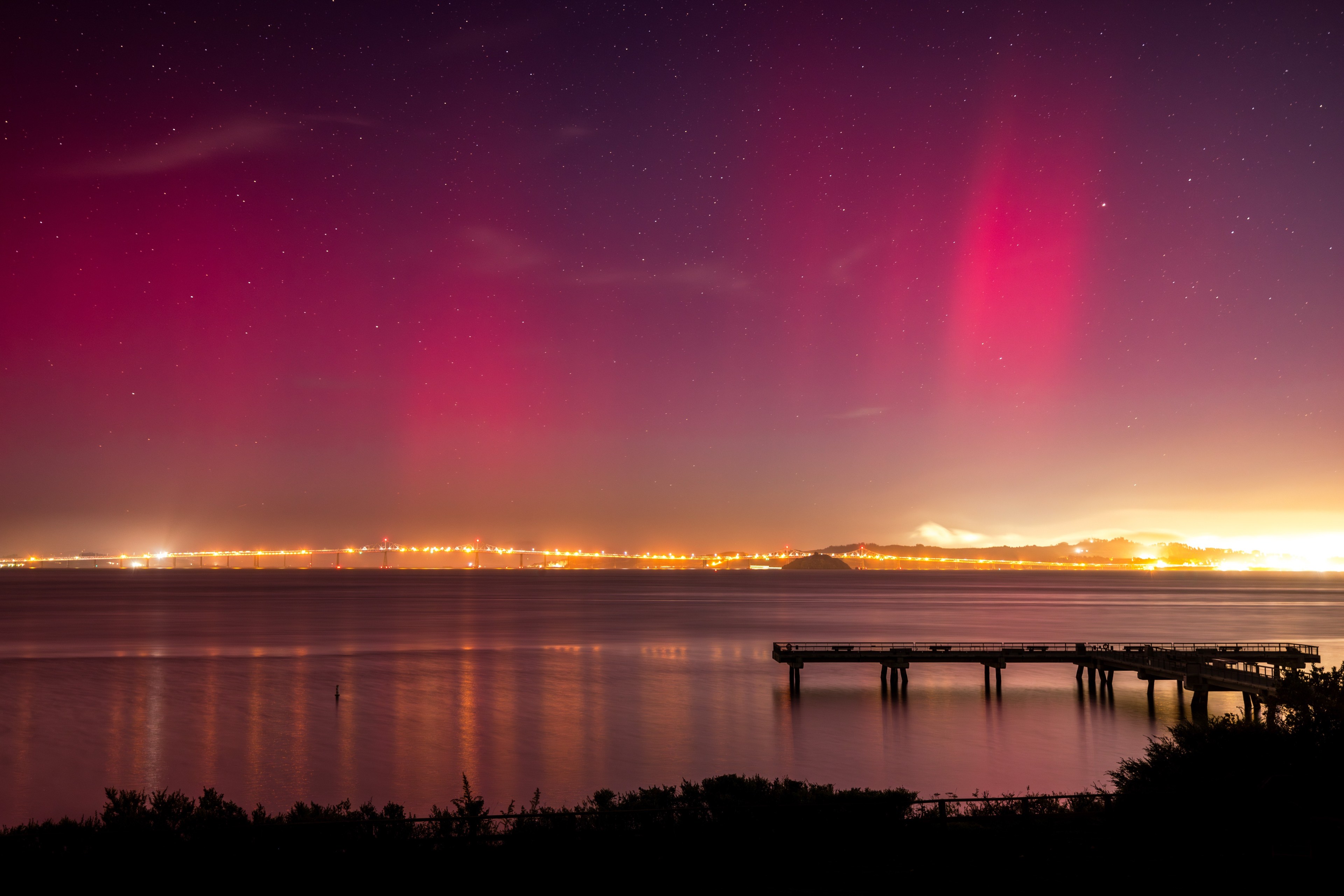 The northern lights over the Richmond San Rafeal Bridge as seen from Tiburon.