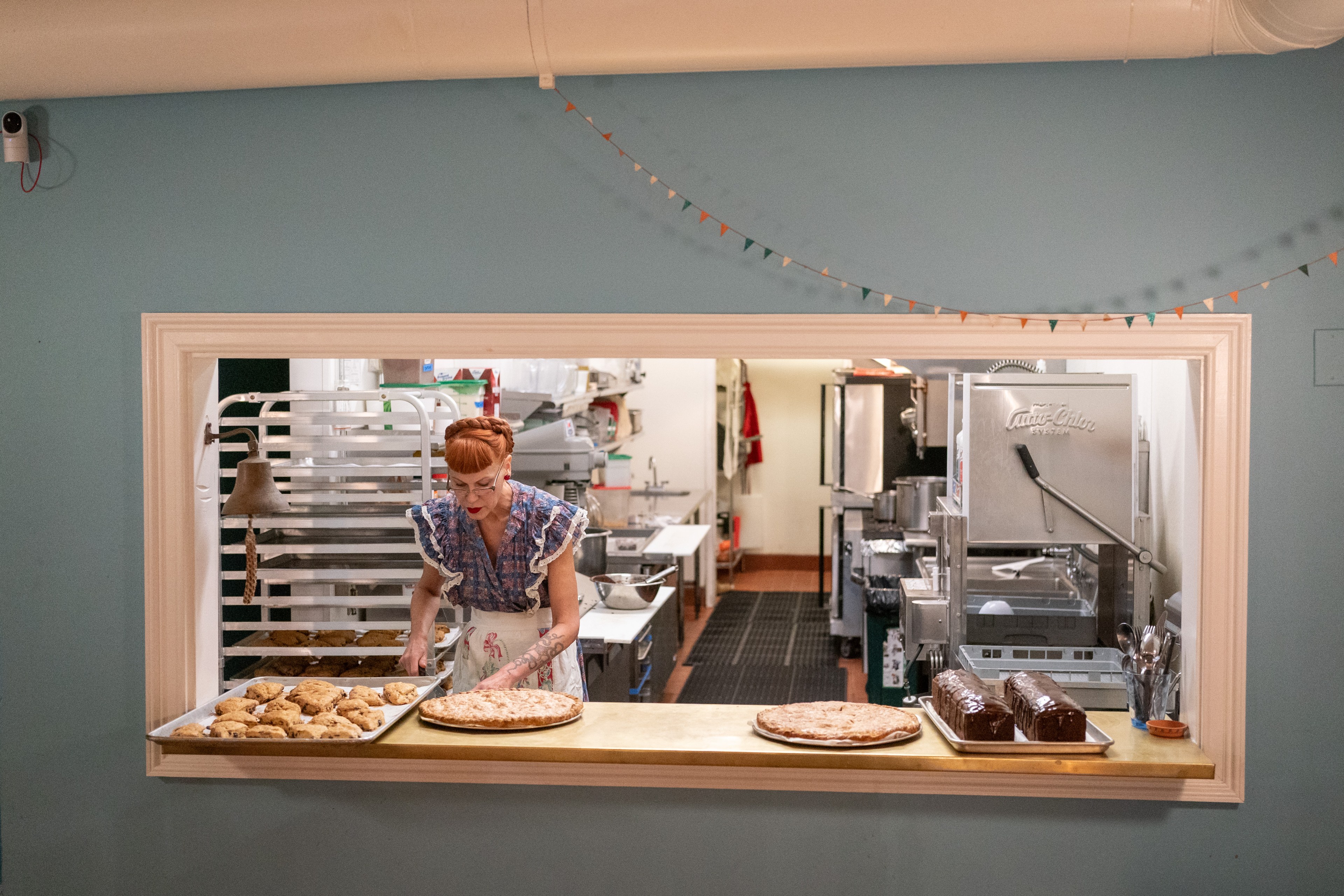 Michelle Polzine prepares baked goods at the City Hope cafe in the Tenderloin District of San Francisco on Oct. 30, 2024. City Hope, a nonprofit, also operates a sober-housing hotel and community center.