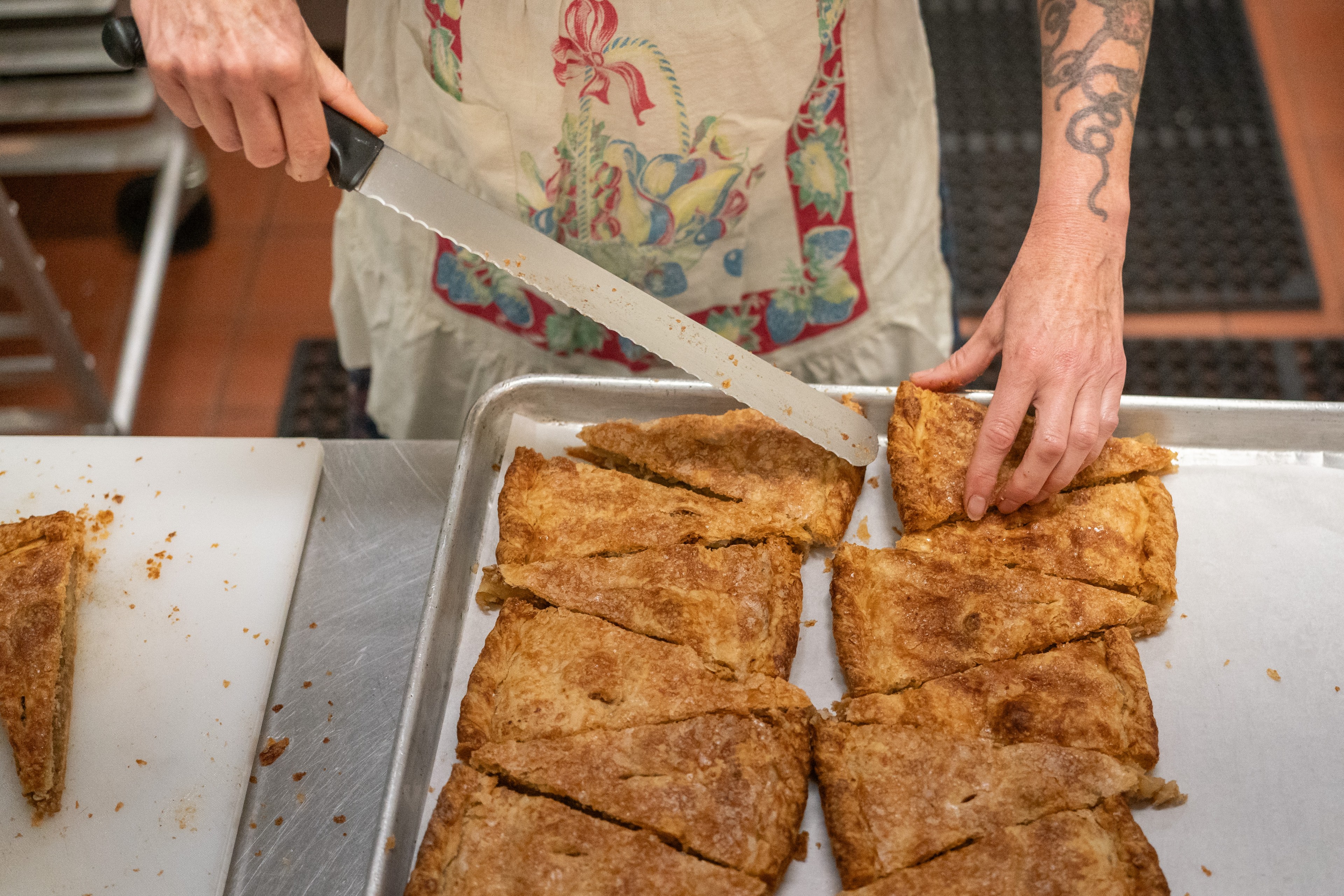 Michelle Polzine prepares apple crostata at the City Hope cafe in the Tenderloin District of San Francisco on Oct. 30, 2024. City Hope, a nonprofit, also operates a sober-housing hotel and community center.