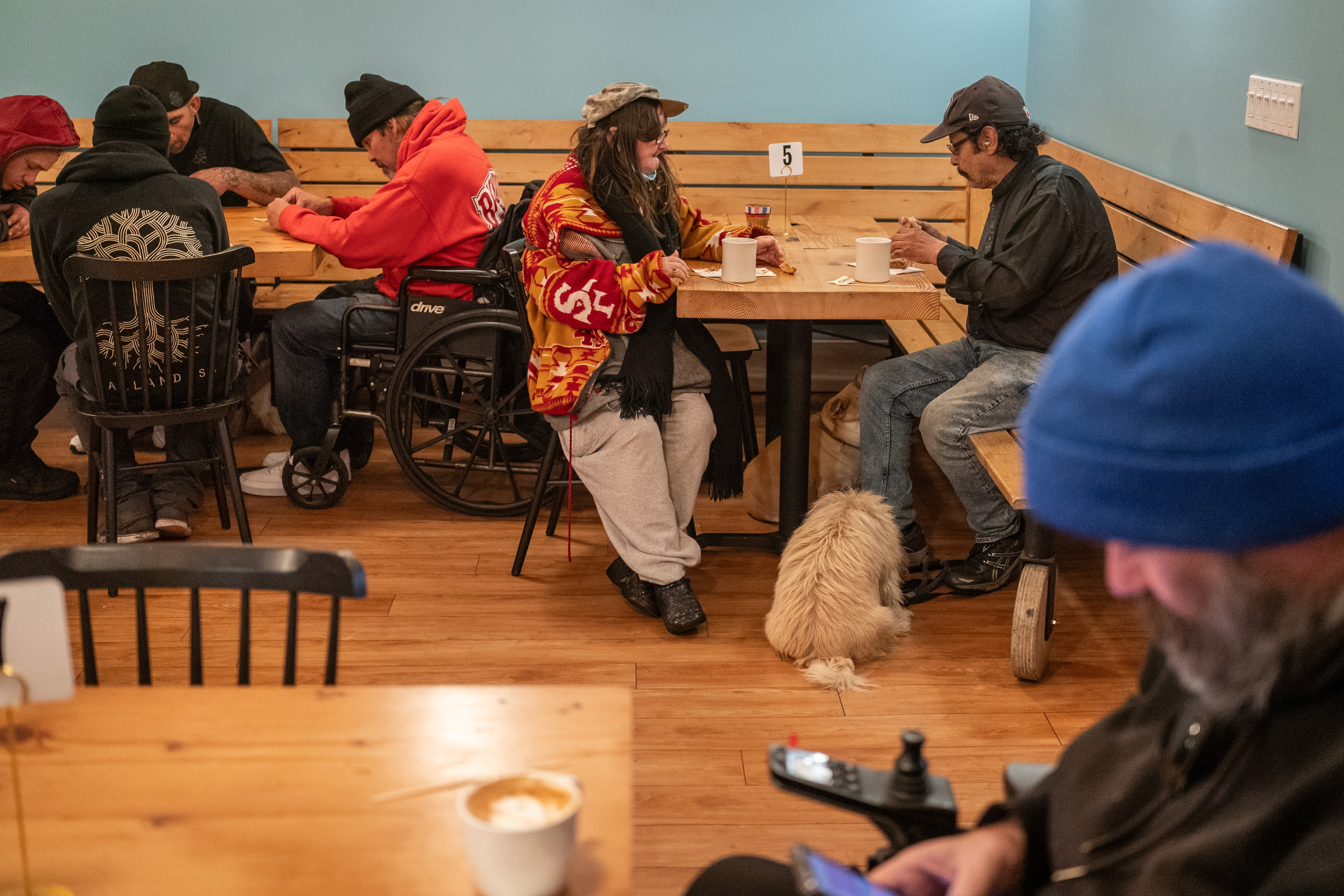 Patrons enjoy breakfast at the City Hope cafe in the Tenderloin District of San Francisco on Oct. 30, 2024. City Hope, a nonprofit, also operates a sober-housing hotel and community center.