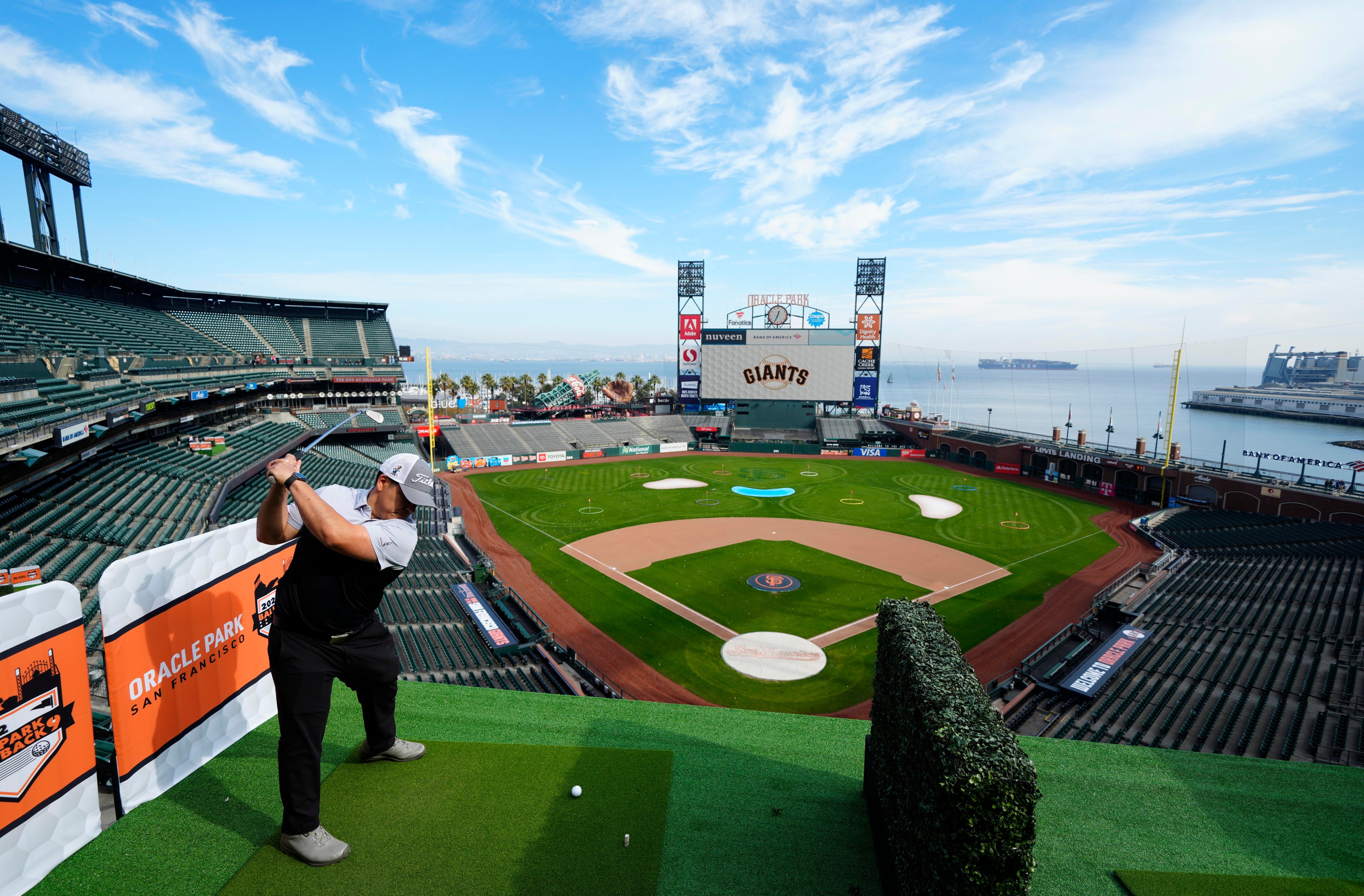 A man playing gold at Oracle Park.