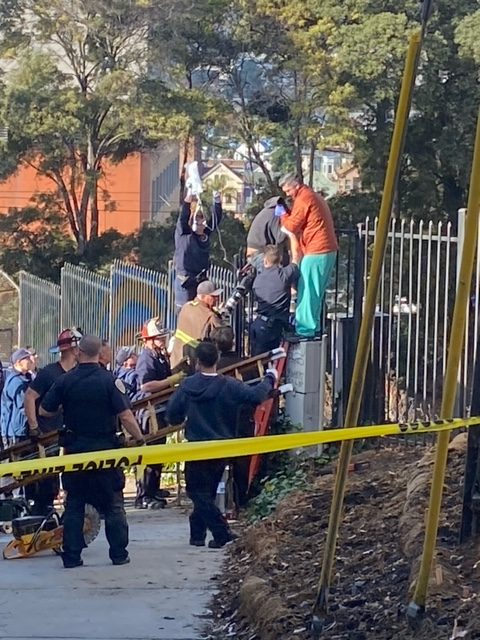 Fire department officers rescue a man impaled on a fence.