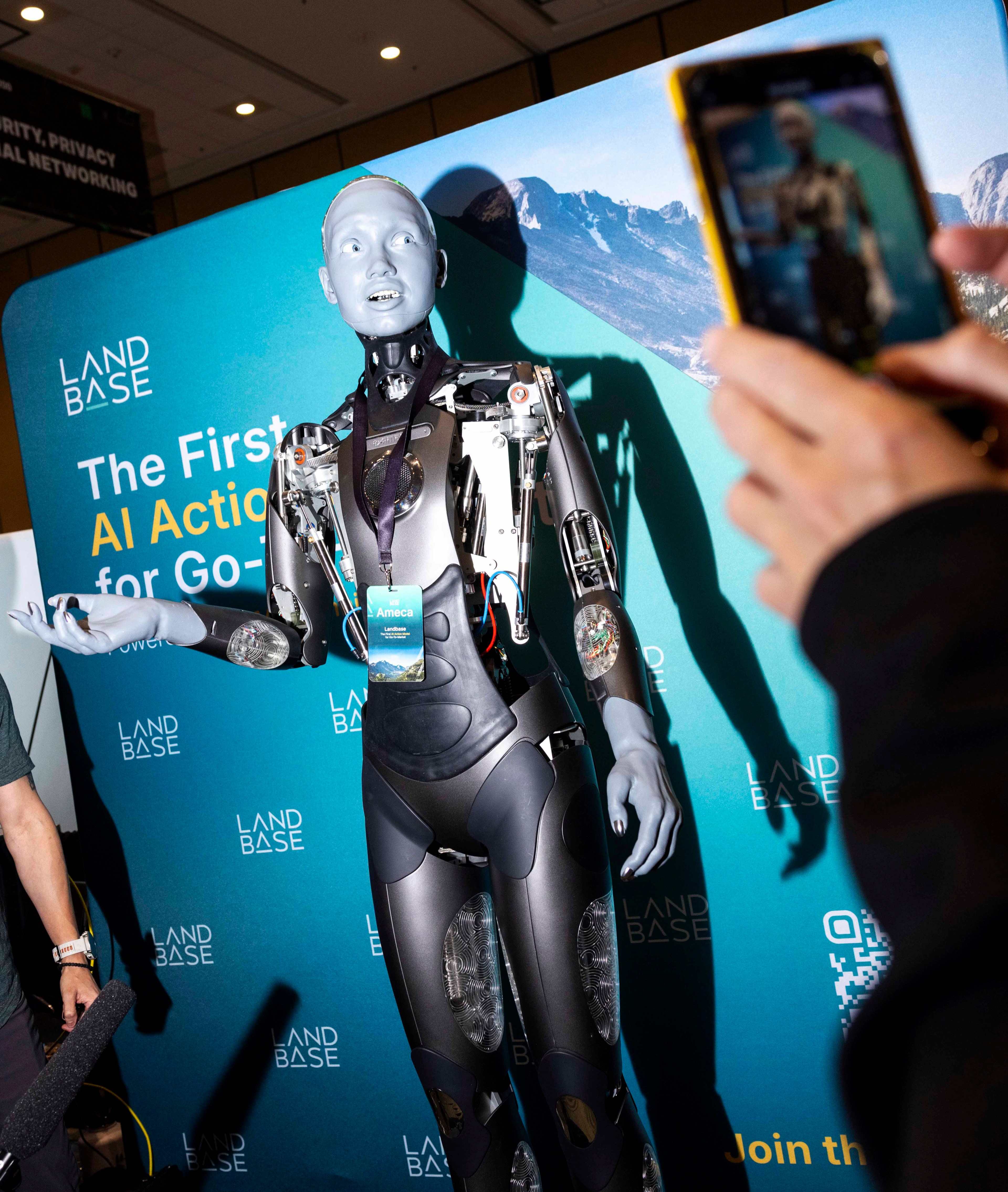 People interact with Landbase’s Ameca robot at TechCrunch Disrupt, hosted at the Moscone Center on October 29, 2024. The annual conference focuses on startups and entrepreneurship.