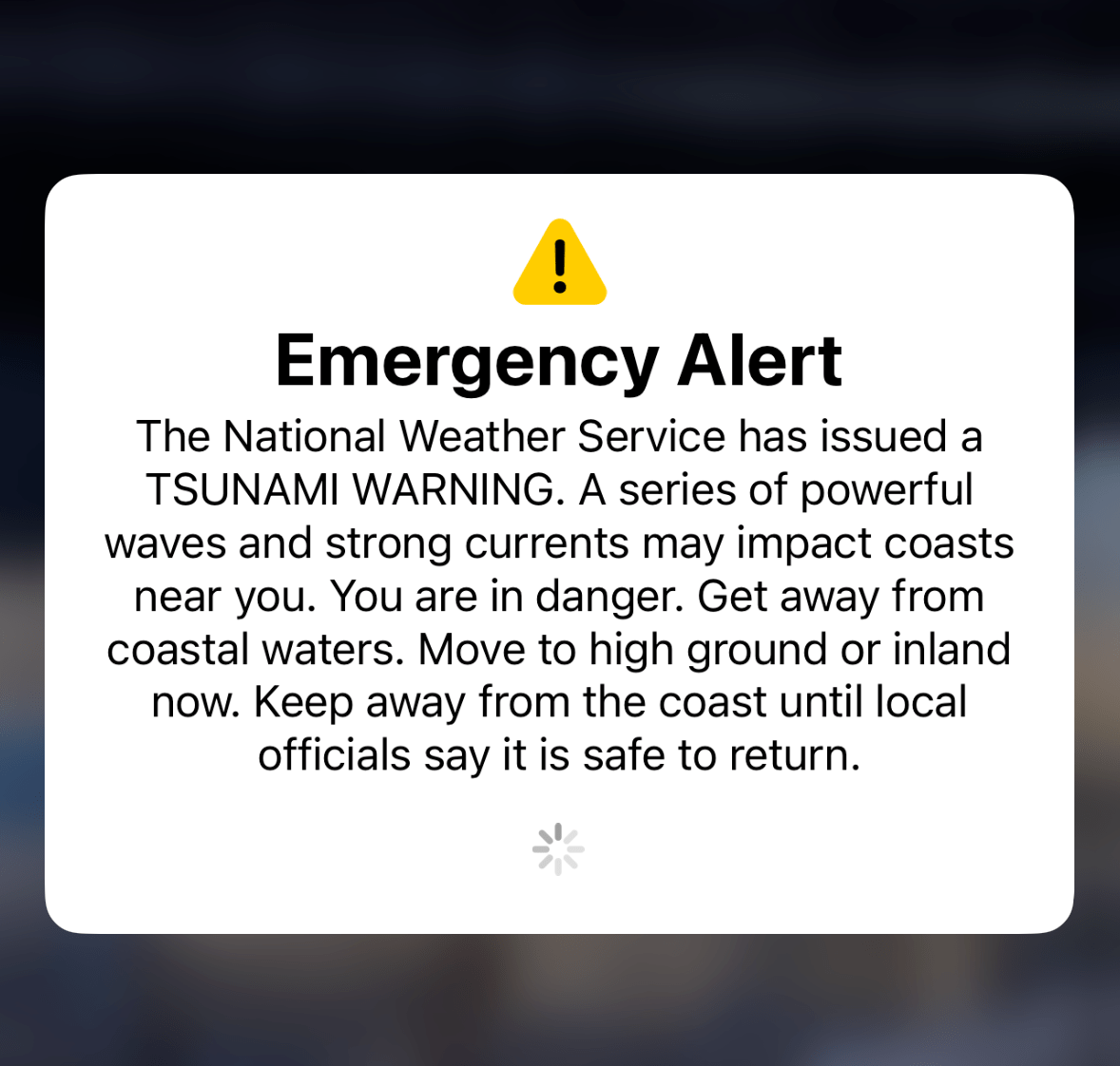 This image shows an emergency alert from the National Weather Service warning of a tsunami. It urges people to move inland or to high ground for safety.