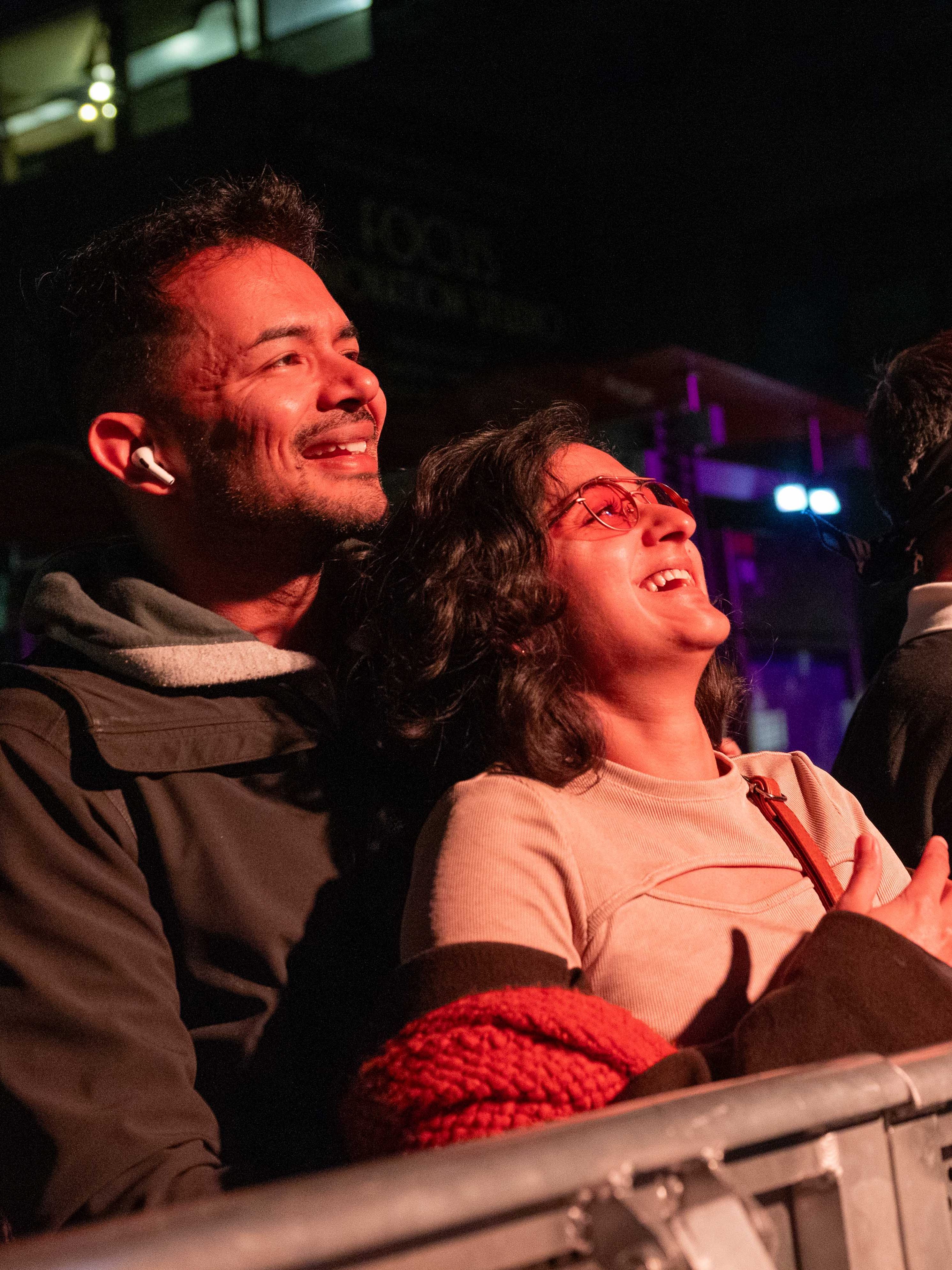 A couple listens to the music