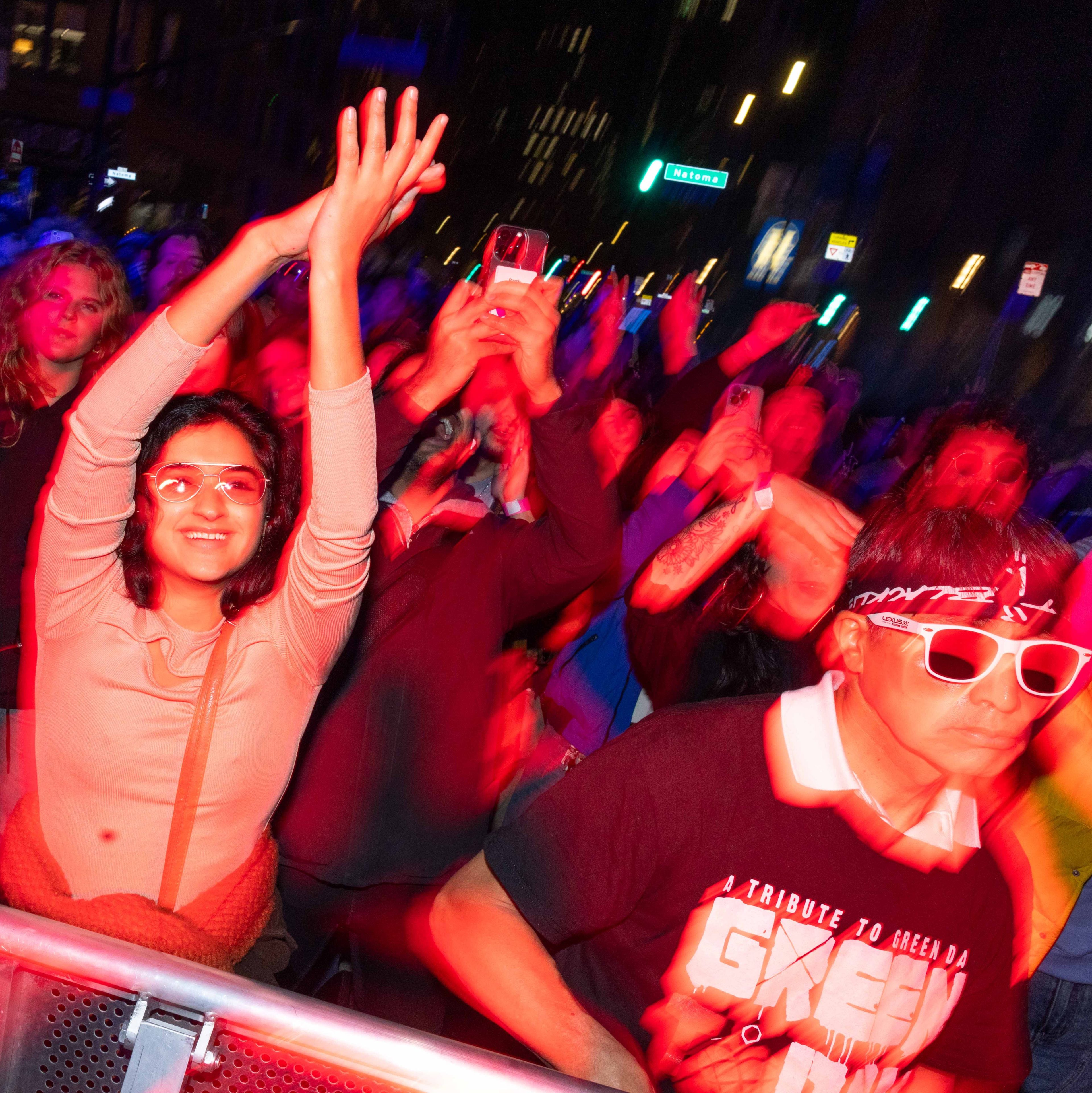 Attendees dance to the music