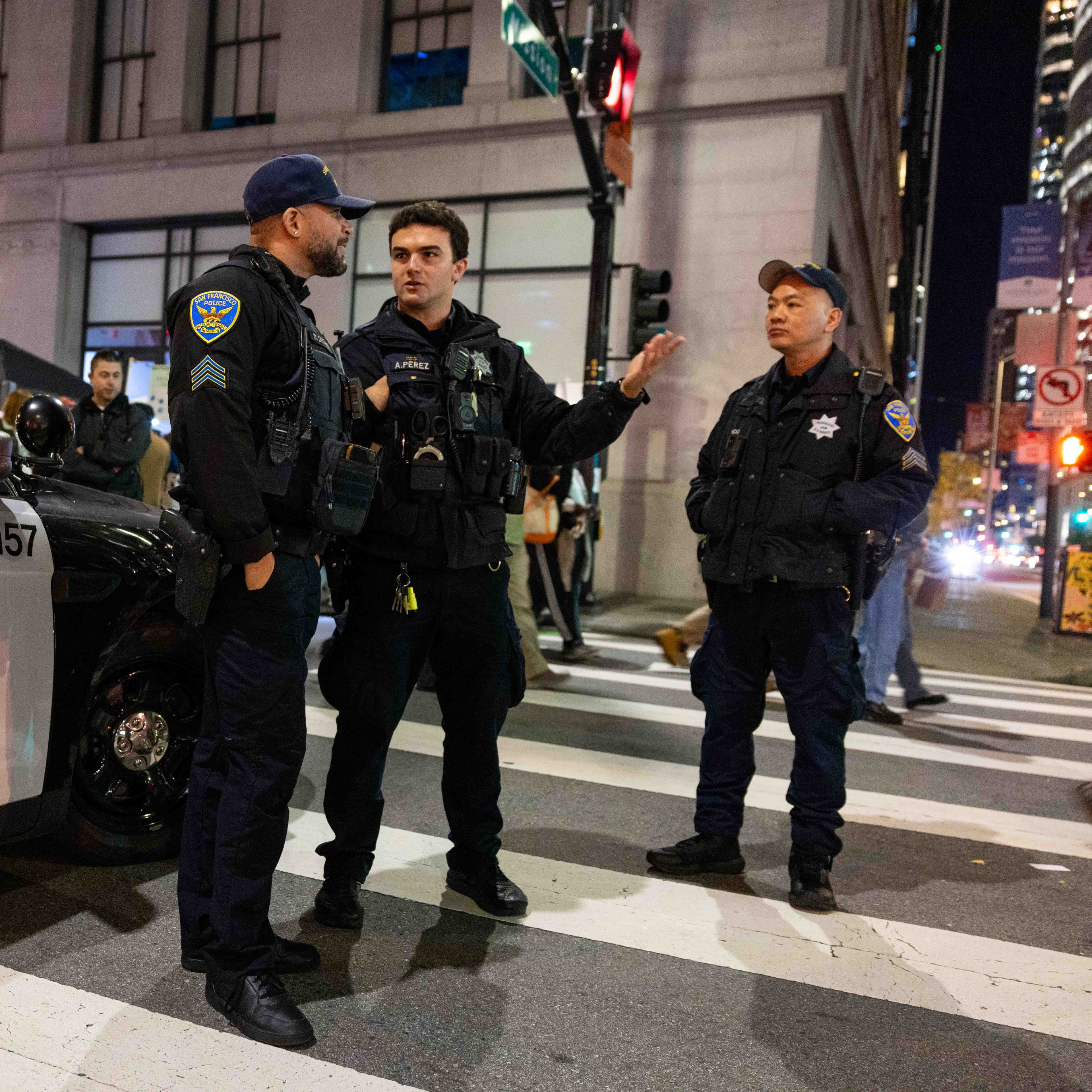 Police officers stand nearby