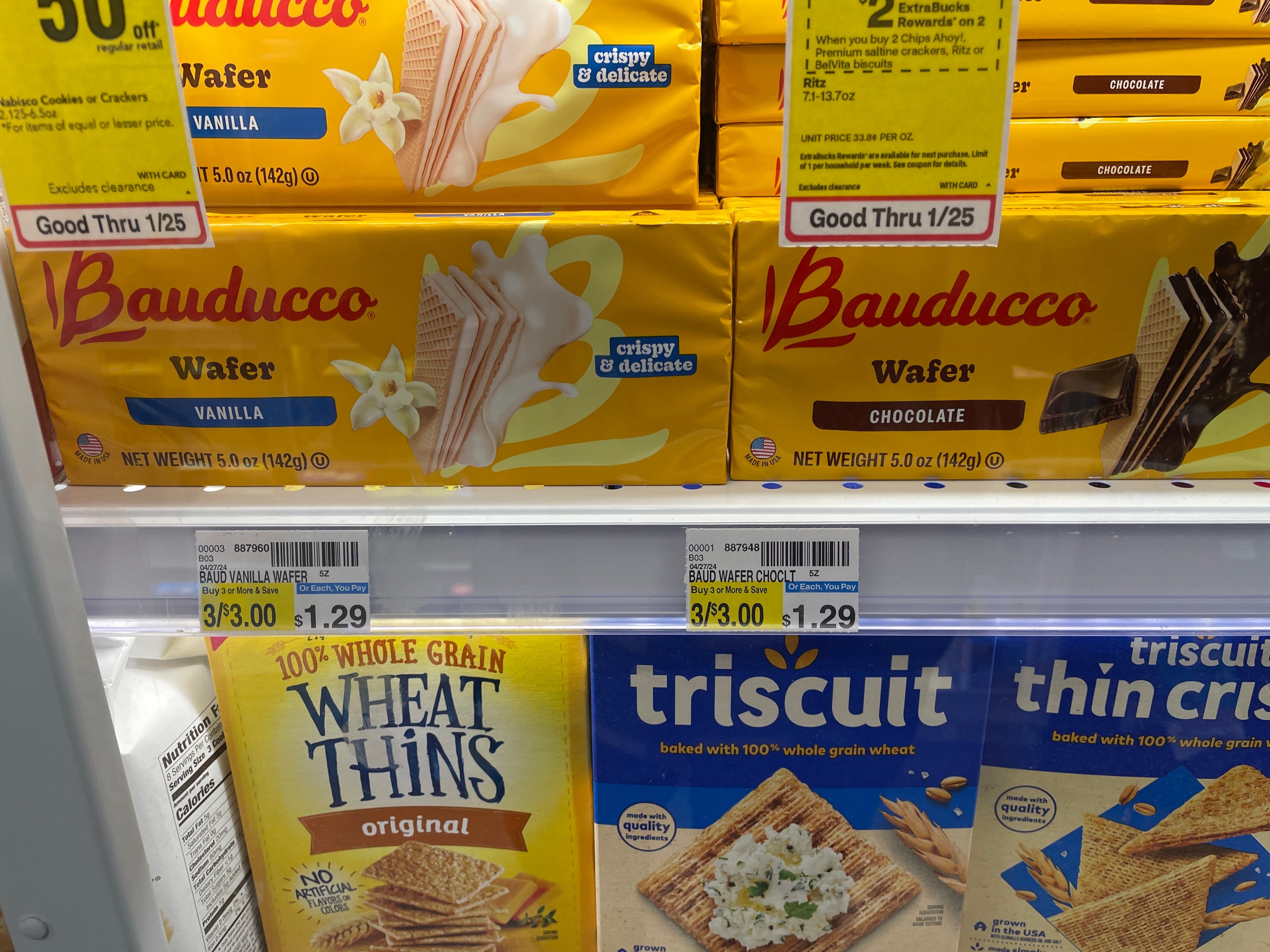 The image shows Bauducco vanilla and chocolate wafer packages on a shelf with a price tag of 3 for $3 or $1.29 each. Below, there are Wheat Thins and Triscuit crackers.