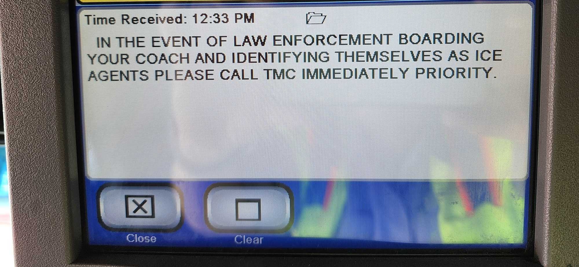 The image shows a screen with a message received at 12:33 PM. It instructs to call TMC immediately if law enforcement identifying as ICE agents board your coach.