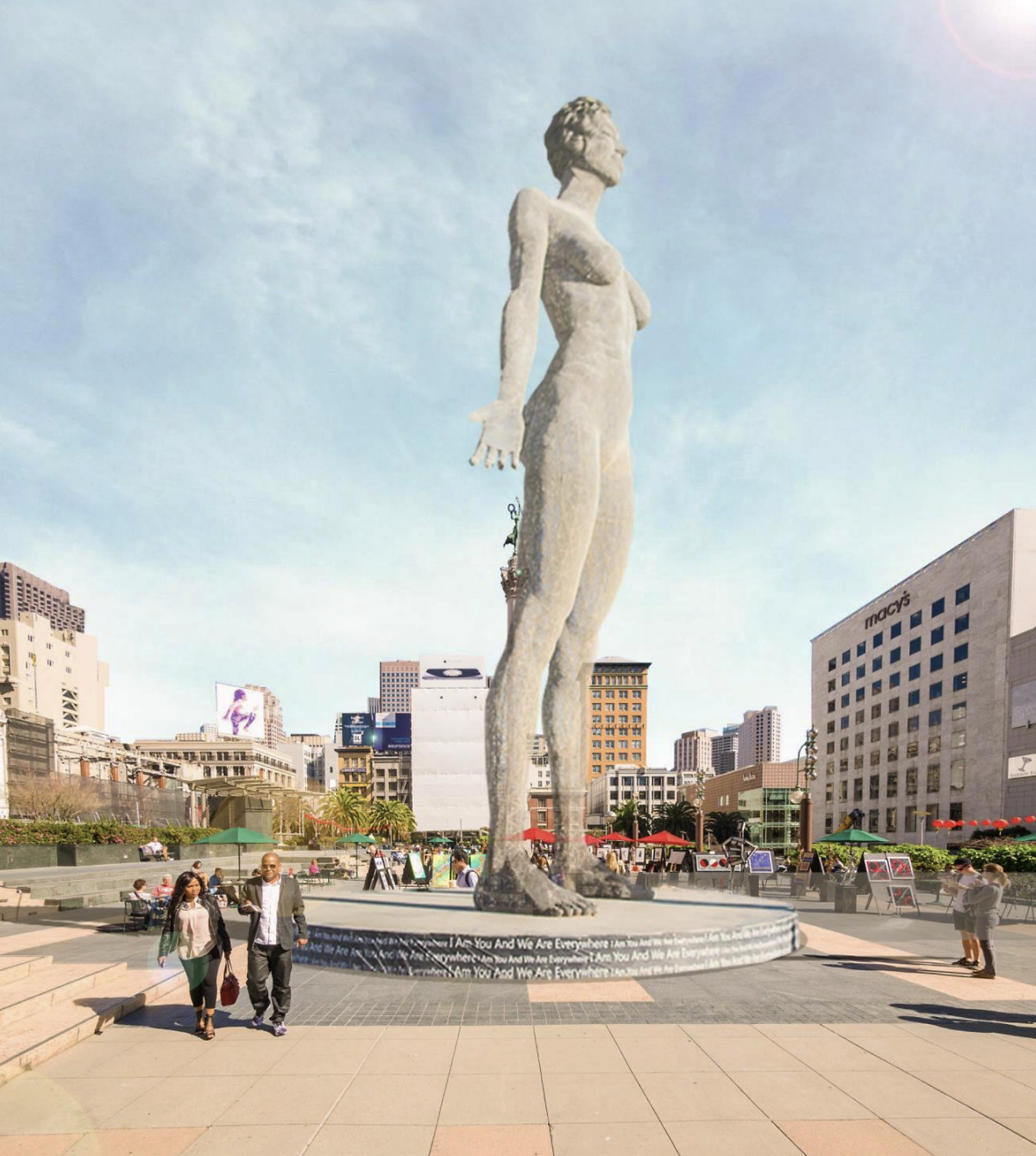 A towering sculpture of a nude human figure stands prominently in a city plaza, surrounded by people and buildings, under a clear blue sky.