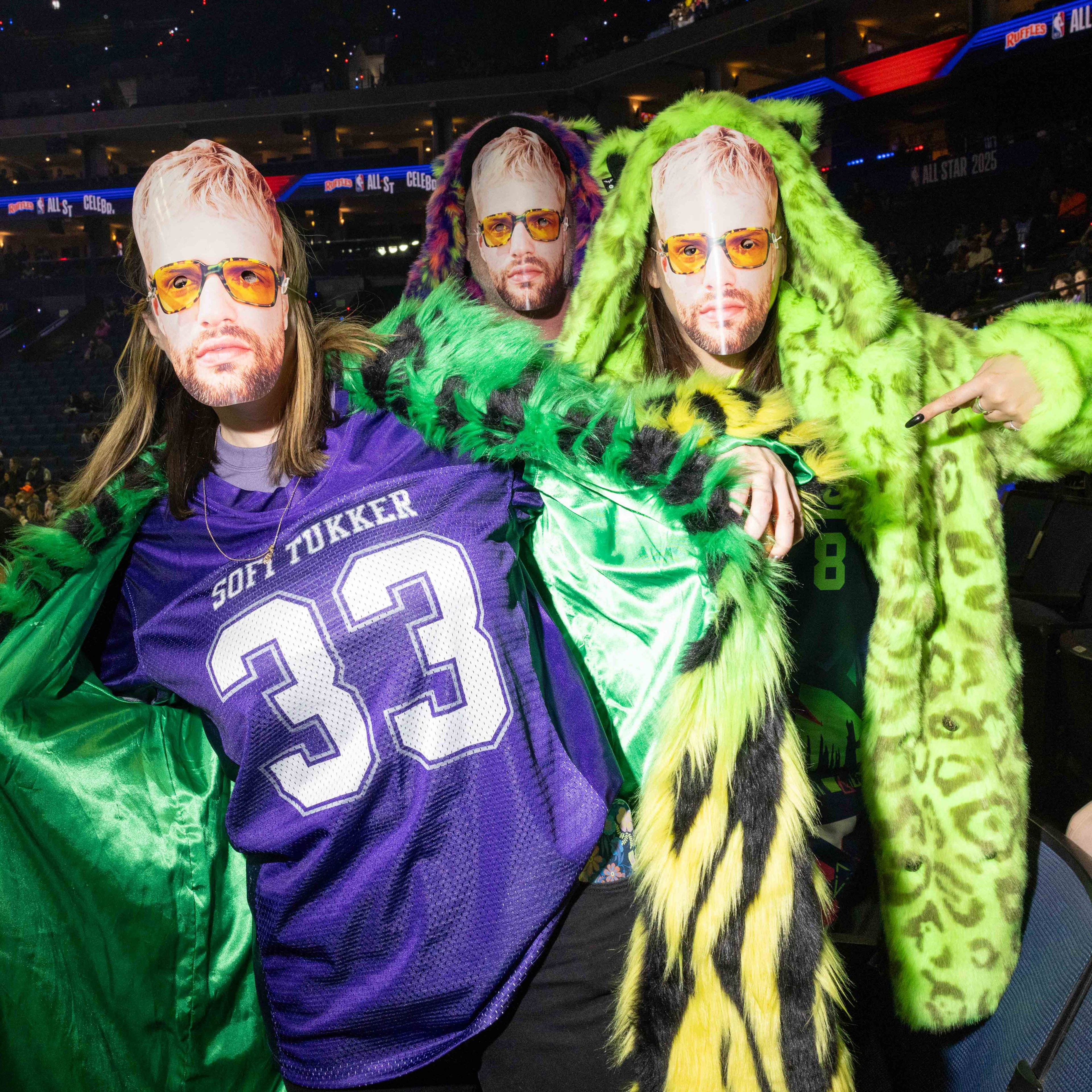 People pose wearing a mask of Tucker Halpern’s face during the celebrity All-Star Weekend game at Oakland Arena in Oakland on Friday, Feb. 14, 2025. Noah Kahan and Kai Cenat are some of the biggest names on Team Bonds, along with assistant coach 2 Chainz. Bonds also has some athletic talent with a former NBA player in Baron Davis and a two-time WNBA All-Star in Allisha Gray.