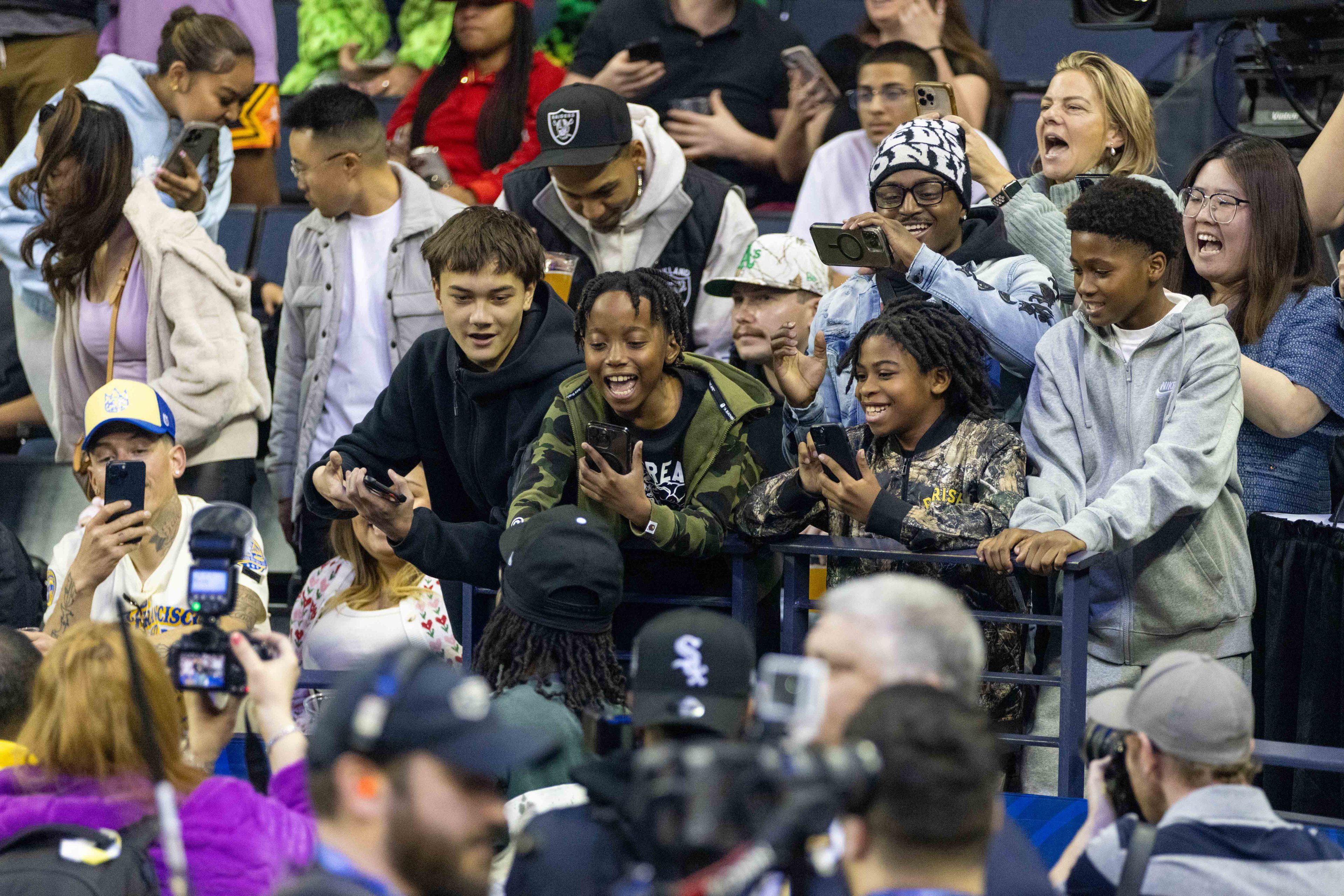 Children react to a celebrity coming to greet them during the celebrity All-Star Weekend game at Oakland Arena in Oakland on Friday, Feb. 14, 2025. Noah Kahan and Kai Cenat are some of the biggest names on Team Bonds, along with assistant coach 2 Chainz. Bonds also has some athletic talent with a former NBA player in Baron Davis and a two-time WNBA All-Star in Allisha Gray.