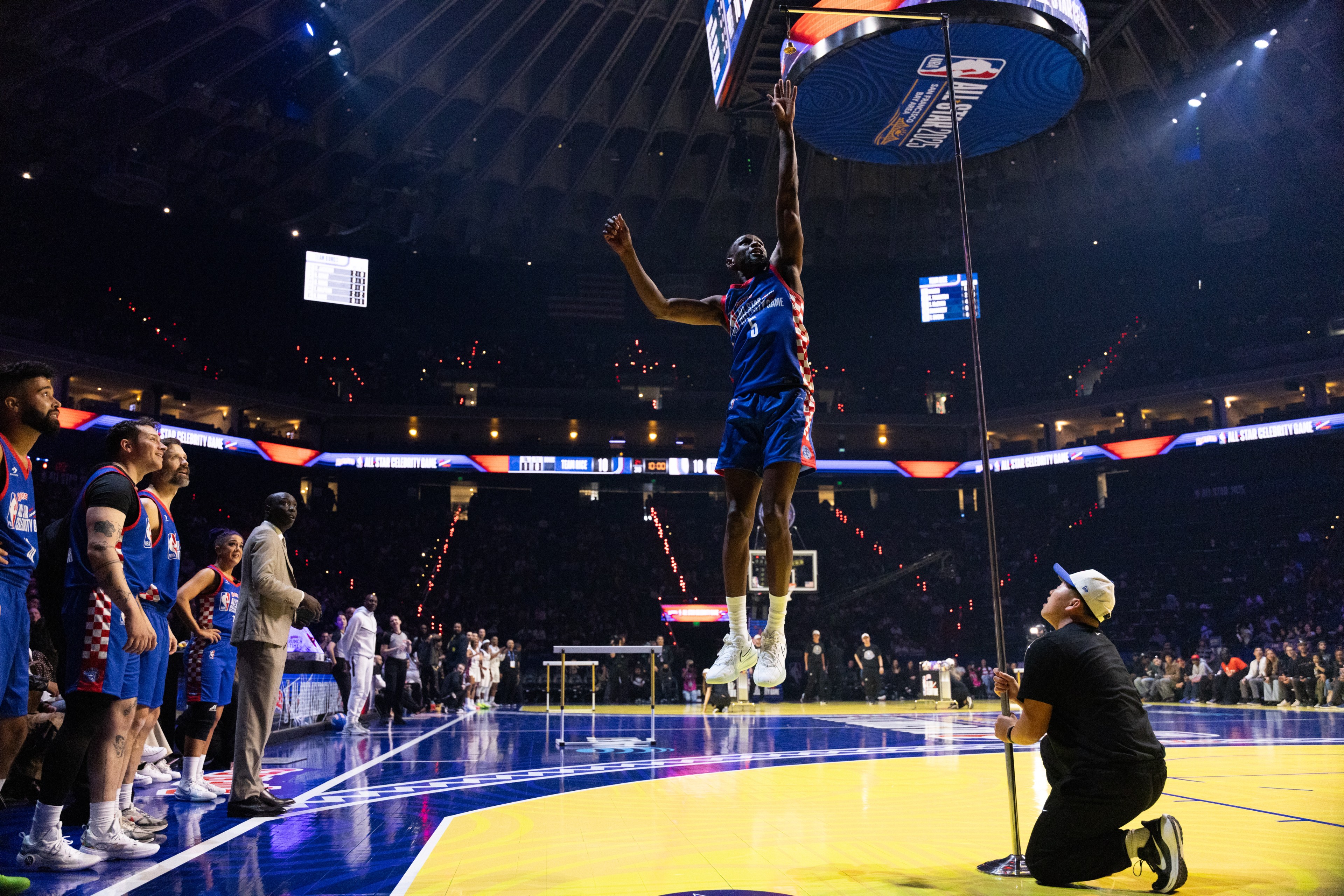 Olympic silver medalist Shelby McEwen does a high jump at the 2025 NBA All-Star Celebrity Game in Oakland, on Friday, Feb. 14, 2025. The Ruffles NBA All-Star Celebrity Game was hosted at Oakland Arena (formerly Oracle Arena) as part of the 2025 NBA All Start Weekend.