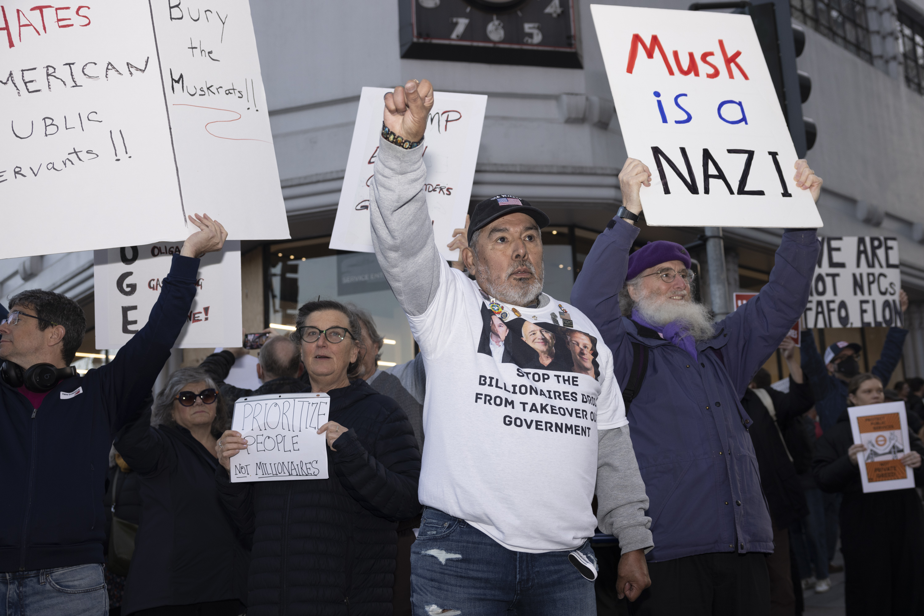 A group of people stand in protest.