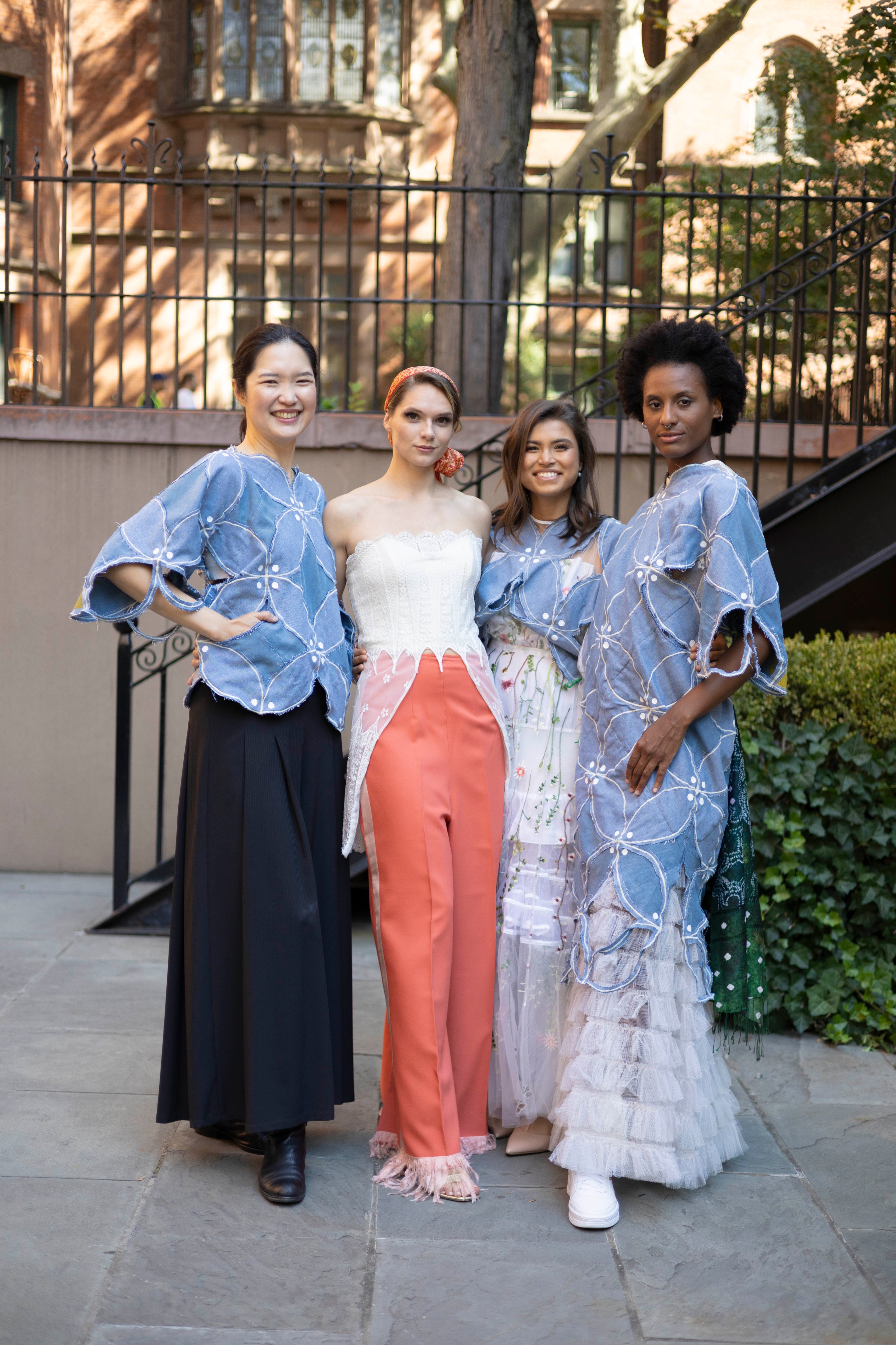 A group of four women posing