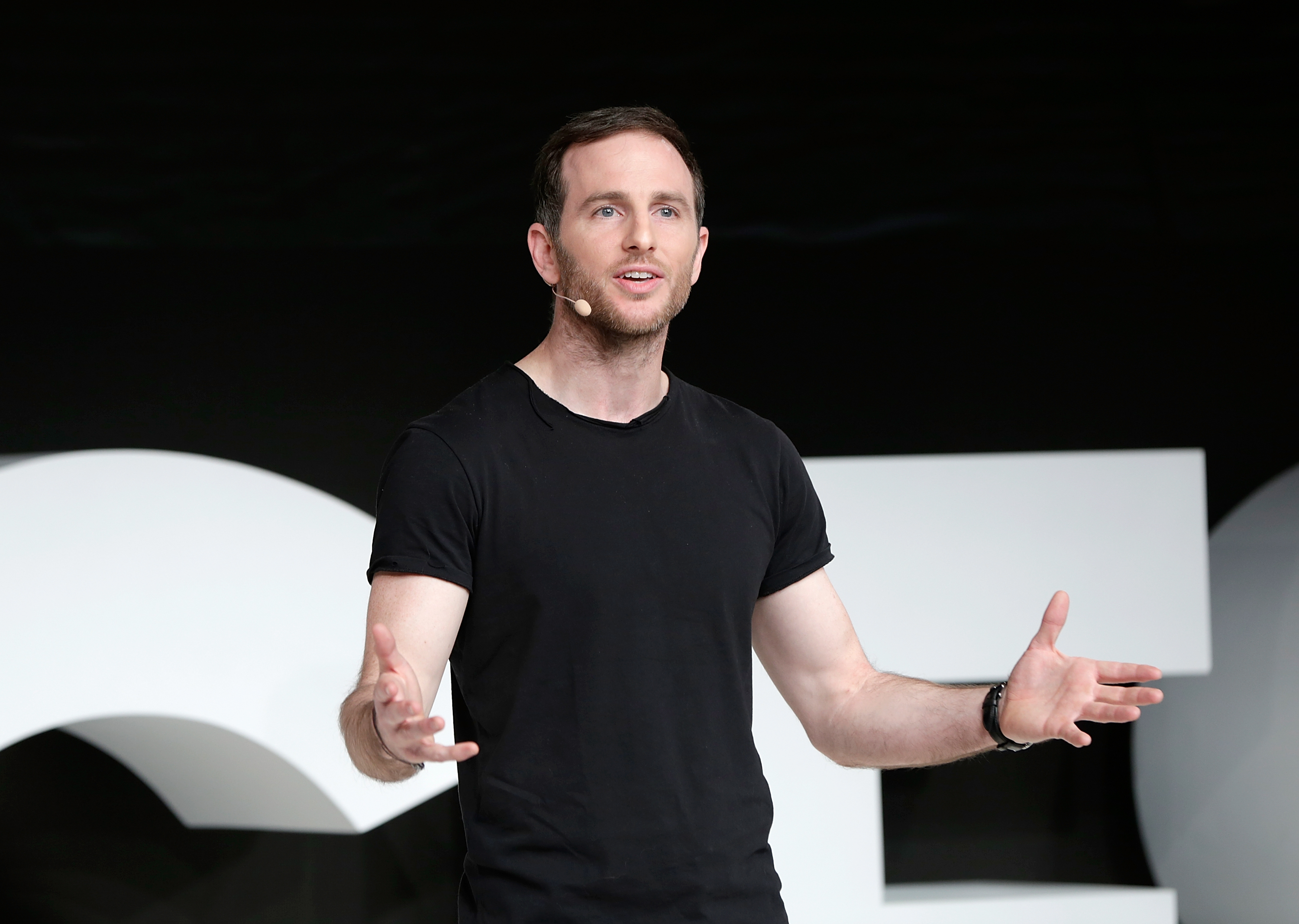 A photo of a man wearing a black shirt