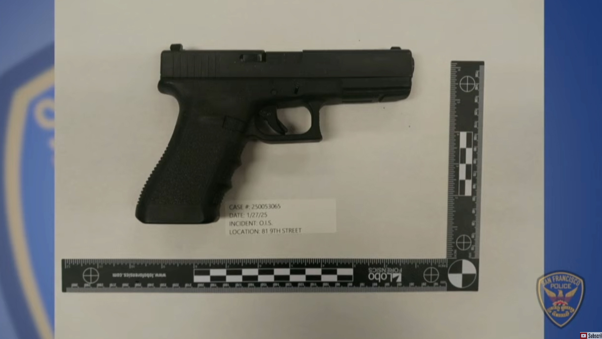 A black handgun is placed on a surface with measurement scales on the sides. It's labeled with case details and has a San Francisco police logo visible.