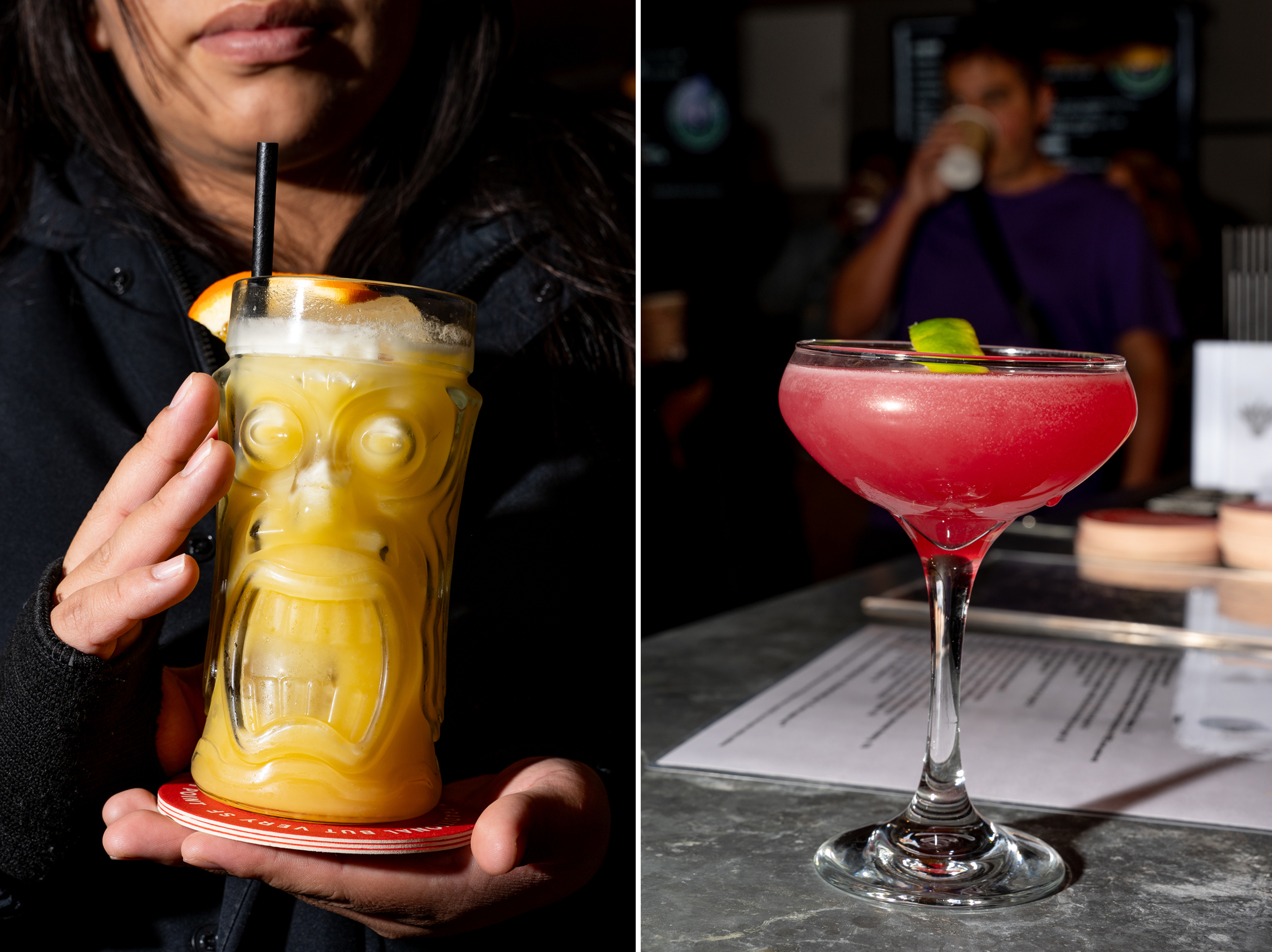 The image shows two drinks: one is a yellow-orange drink in a tiki glass with a straw and orange slice held by a person; the other is a pink cocktail in a coupe glass with a lime garnish on a table.