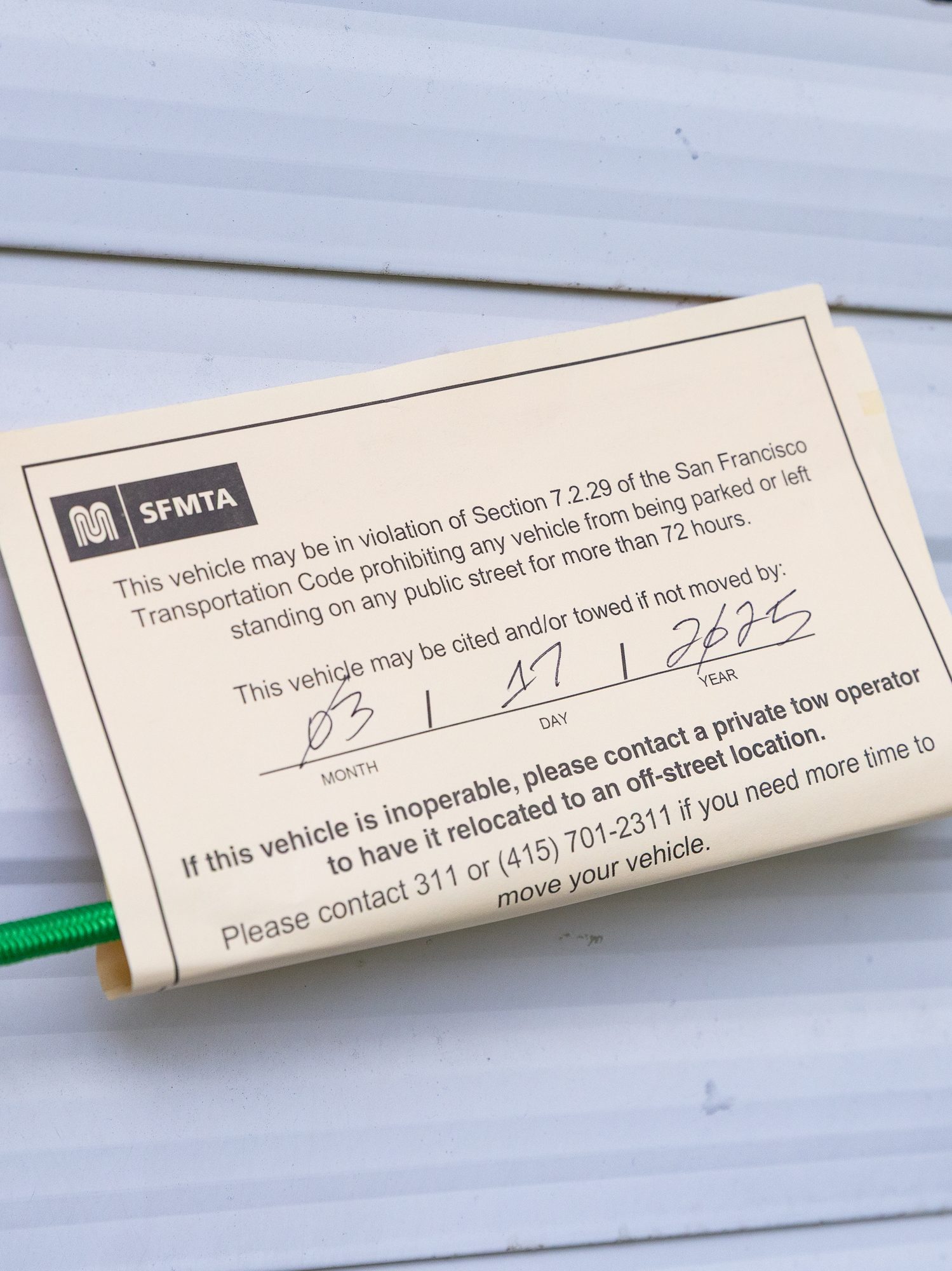 A notice from SFMTA warns a vehicle may violate a San Francisco code for being parked over 72 hours. It’s dated March 17, 2025.