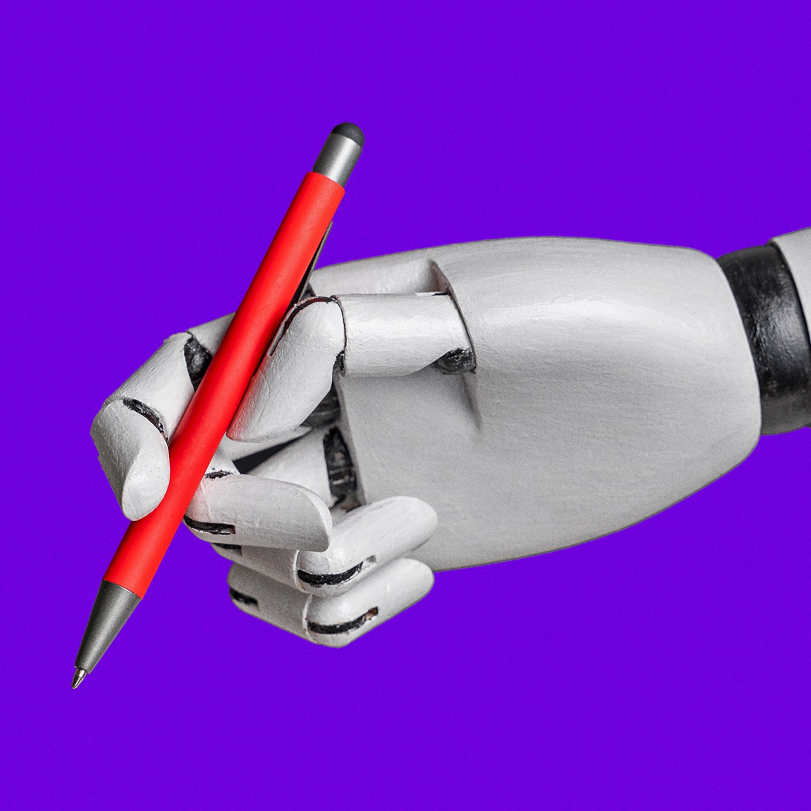 A robotic hand holds a red pen against a vibrant purple background, showcasing precise grip and mechanical joints.