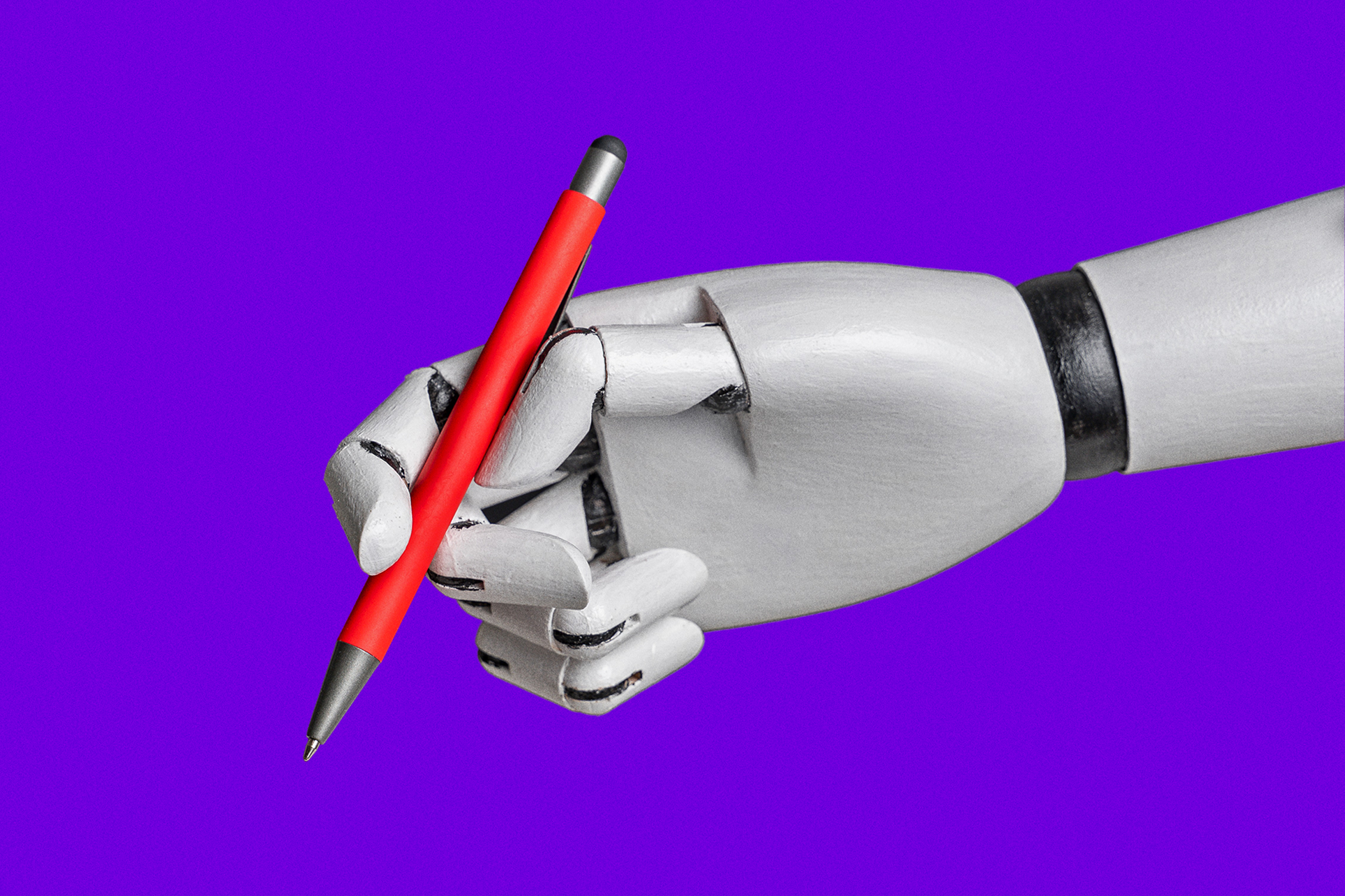 A robotic hand holds a red pen against a vibrant purple background, showcasing precise grip and mechanical joints.