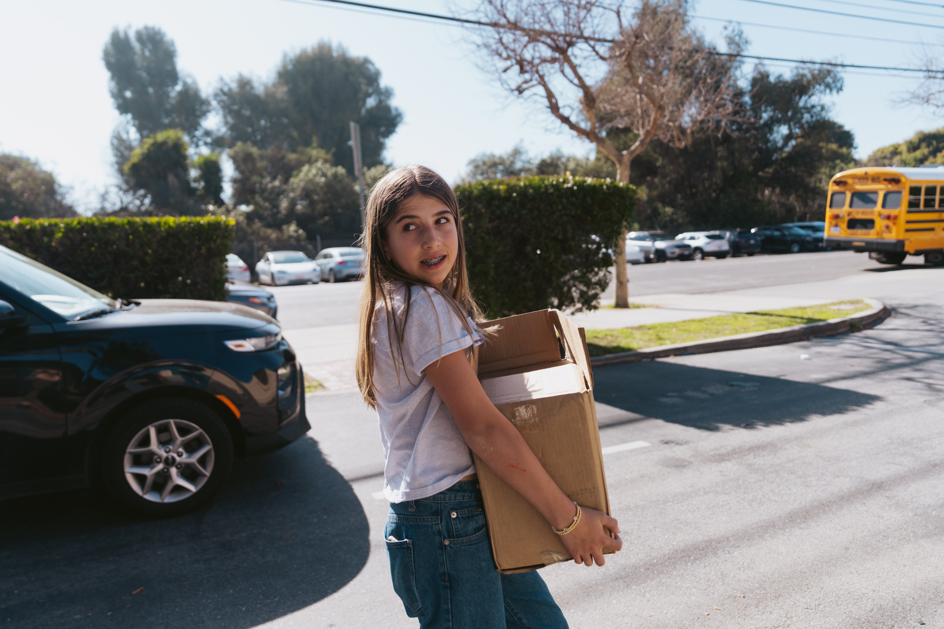 Evening Wiesler carries a box of fire journals in Los Angeles on Thursday, Feb. 20, 2025, to donate to Palisades Charter Elementary which is currently colocated with Brentwood Science Magnet Elementary after their building burned down in the Palisades fire  “Children feel very isolated and alone,” Palisades Elementary principal Juliet Herman said. “ That connection with other people who've lived through the same experience, who can say, ‘this happened to me and this is how I healed from it, or this is how I am still healing from it,’ I think that is incredibly powerful.”  Over the course of two days, the Wieslers donated journals to three schools which were destroyed: Marquez Elementary, Palisades Charter Elementary, and Village School, as well as to Harvard Westlake, where 100 students and faculty were affected by the Palisades and Eaton fires.