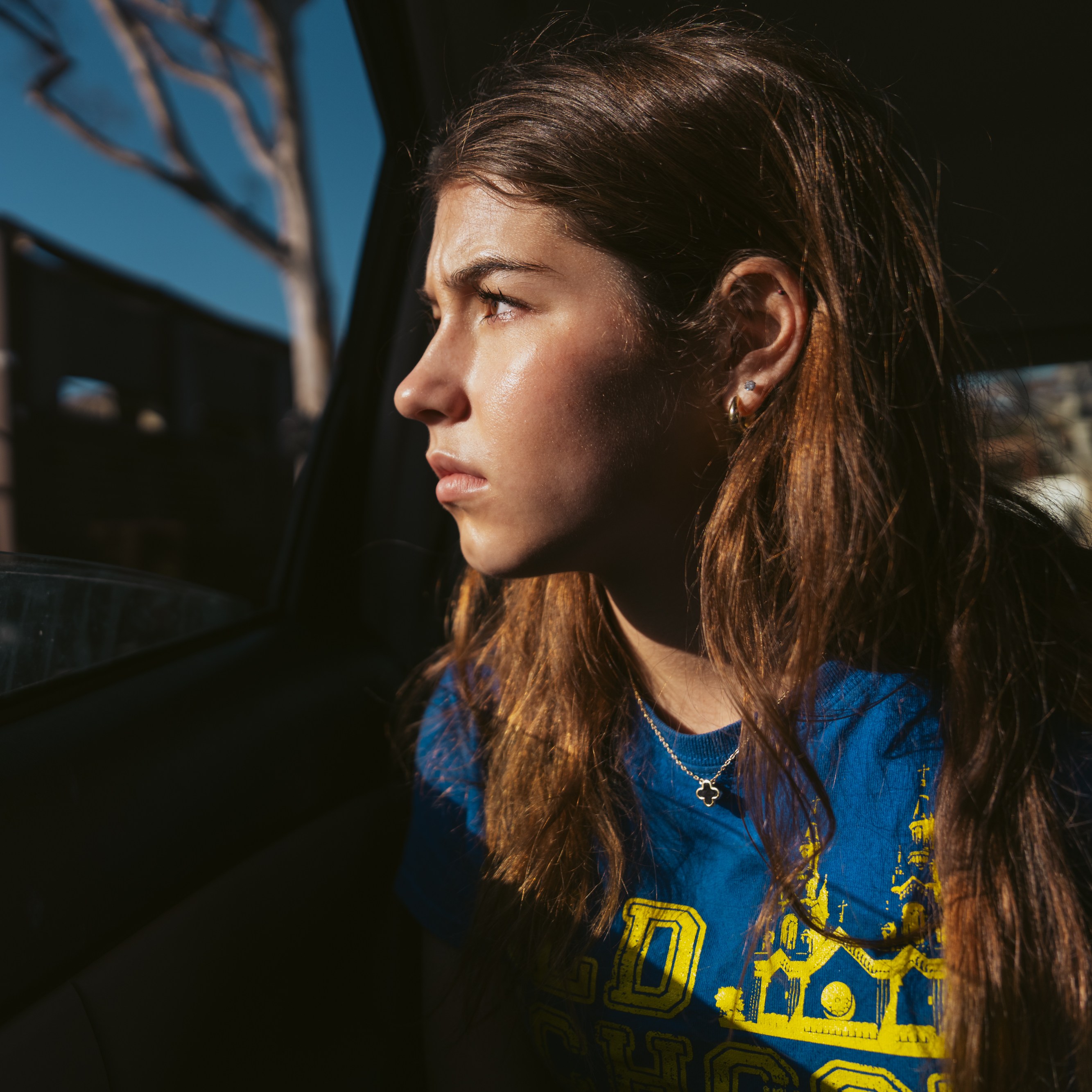 Silver Wiesler sits in her mom’s car in Pacific Palisades in Los Angeles on Thursday, Feb. 20, 2025. The trip to Pacific Palisades was the first time the Wiesler sisters experienced an area decimated by a fire. When their home burned in 2016, they didn’t witness the devastation and only returned two and a half years later when it was rebuilt. “ It feels like closure in a way,” Wiesler said. “ Something about looking into people's houses and seeing their intimate belongings in the rubble was just a really powerful experience and that just made me wanna do this work even more.”