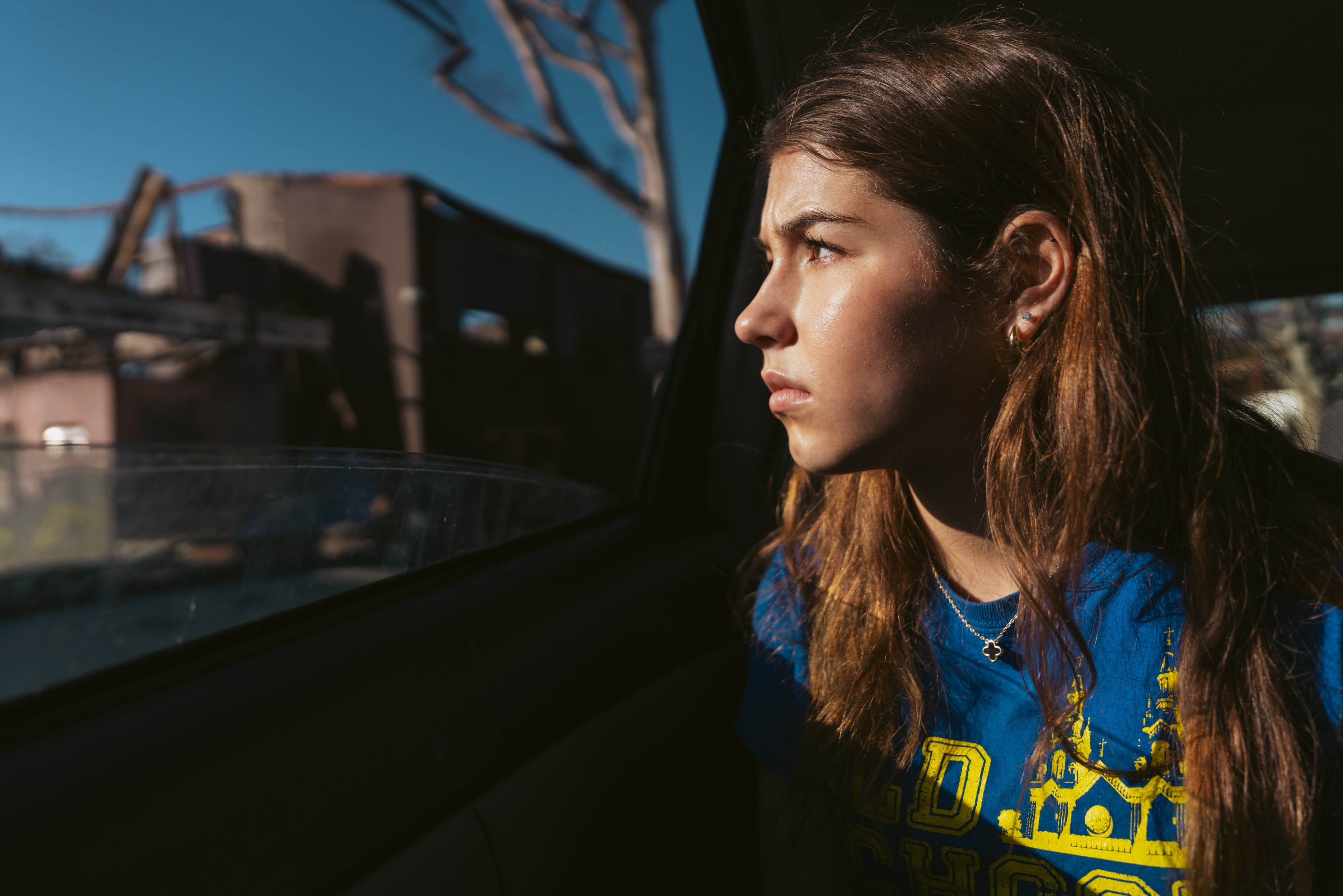 Silver Wiesler sits in her mom’s car in Pacific Palisades in Los Angeles on Thursday, Feb. 20, 2025. The trip to Pacific Palisades was the first time the Wiesler sisters experienced an area decimated by a fire. When their home burned in 2016, they didn’t witness the devastation and only returned two and a half years later when it was rebuilt. “ It feels like closure in a way,” Wiesler said. “ Something about looking into people's houses and seeing their intimate belongings in the rubble was just a really powerful experience and that just made me wanna do this work even more.”