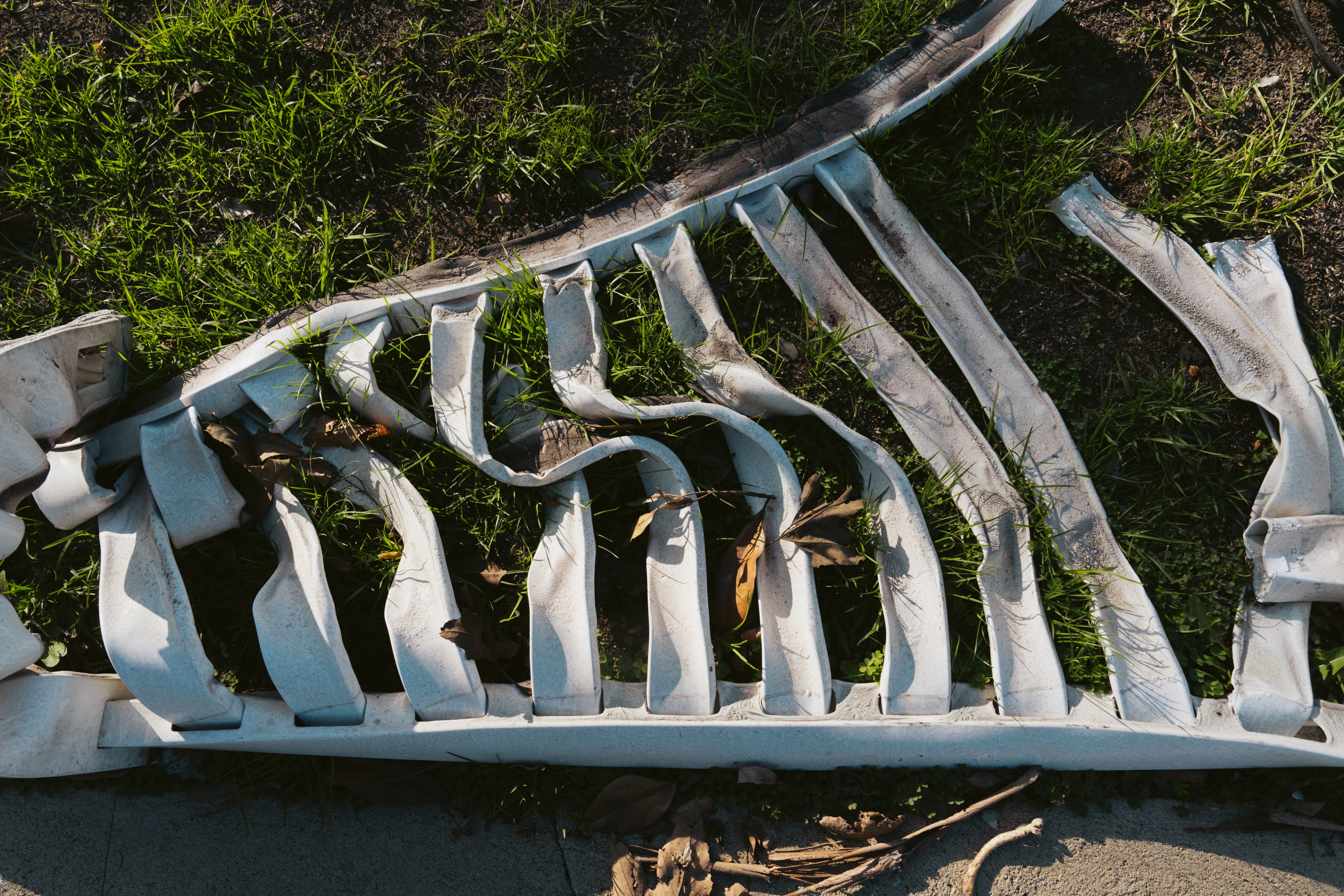 A melted white fence is seen in Pacific Palisades in Los Angeles on Thursday, Feb. 20, 2025.