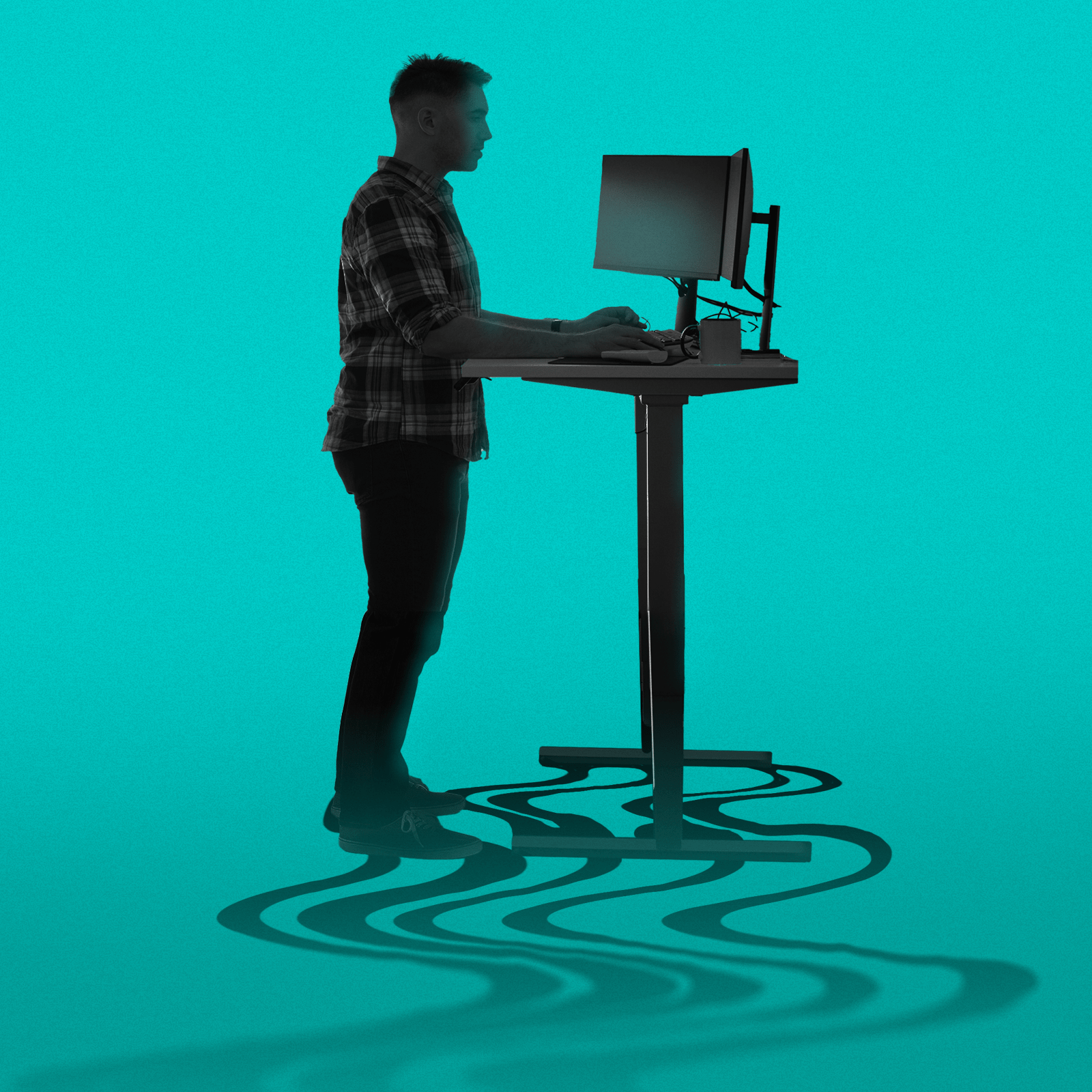 A person stands at a height-adjustable desk using a computer. Their shadow on the floor has a wavy pattern. The background is a solid teal color.