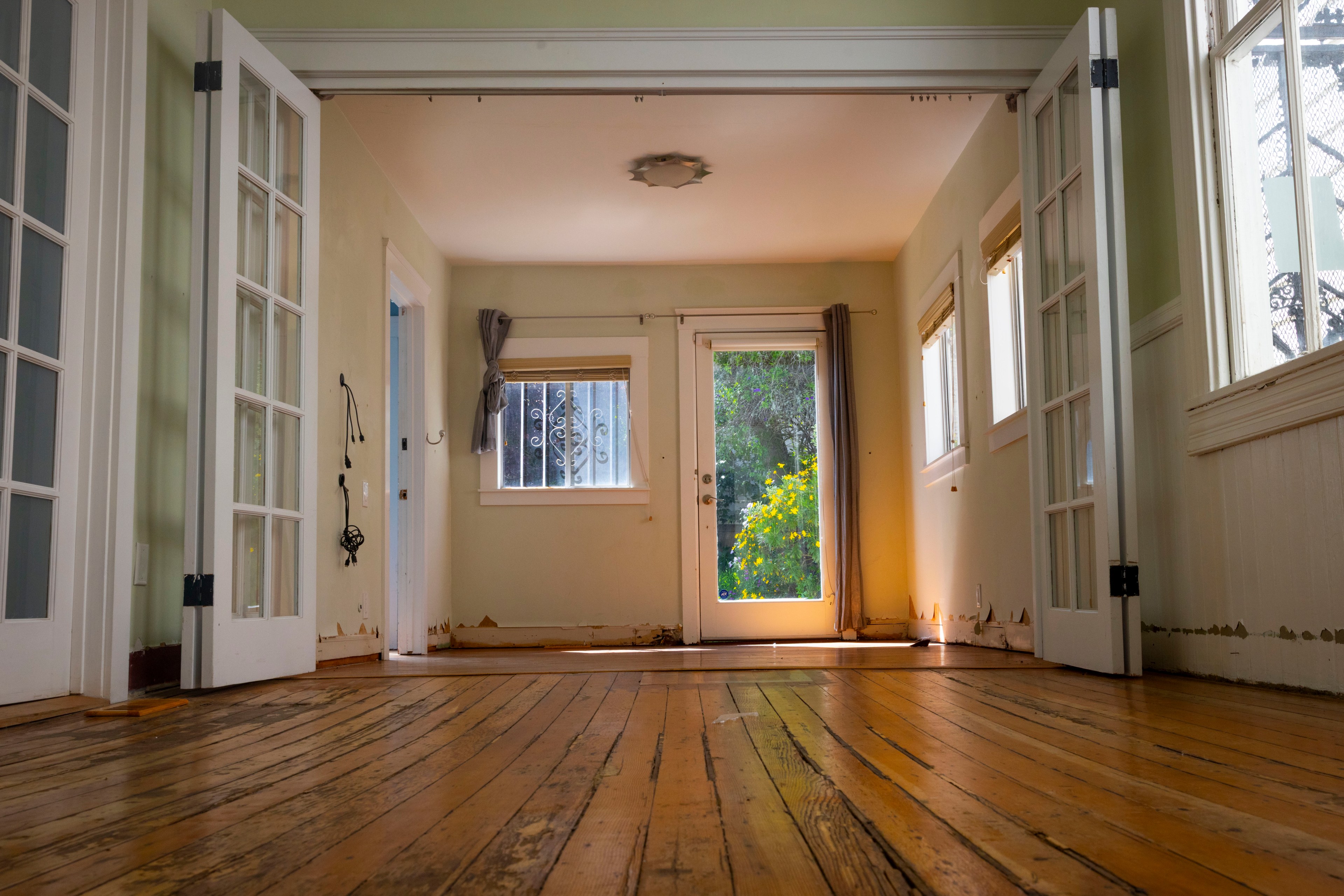 Buckled wood flooring in a damaged home.