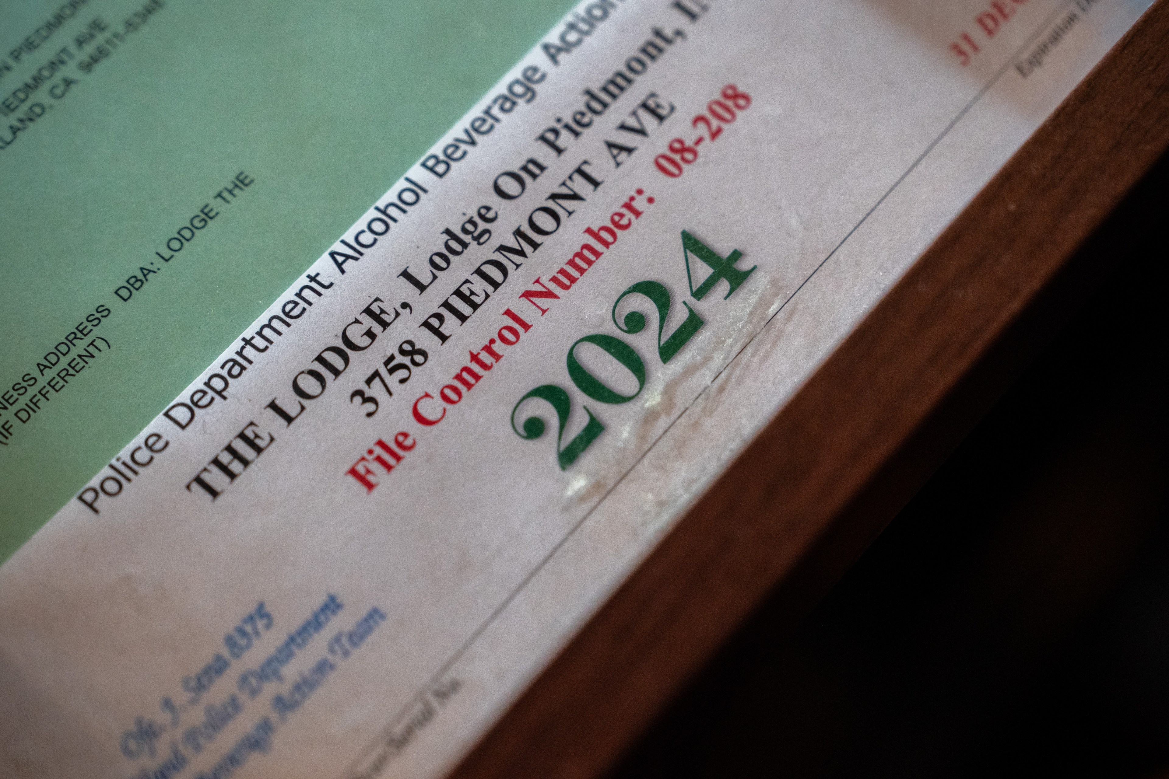 The image shows part of a document related to a police department alcohol beverage action, featuring a 2024 date and address details in text.
