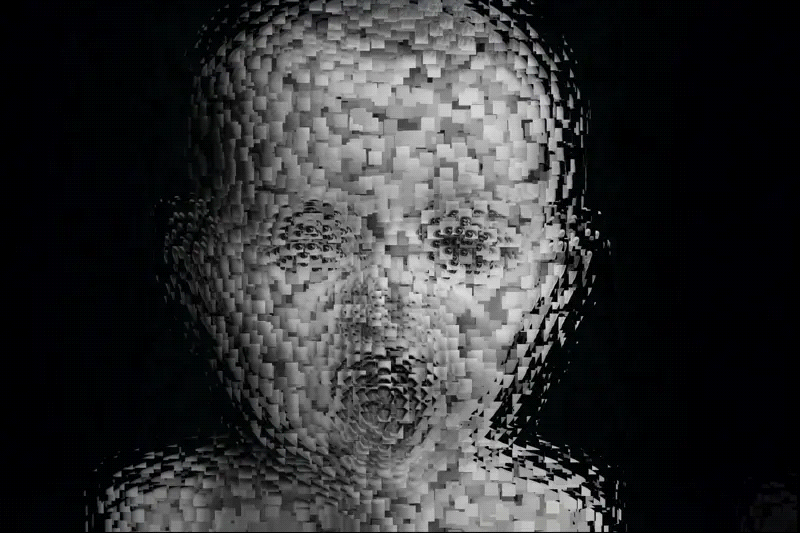 The image shows a distorted, mosaic-like face of a baby, composed of numerous small squares, creating an abstract, pixelated appearance against a dark background.