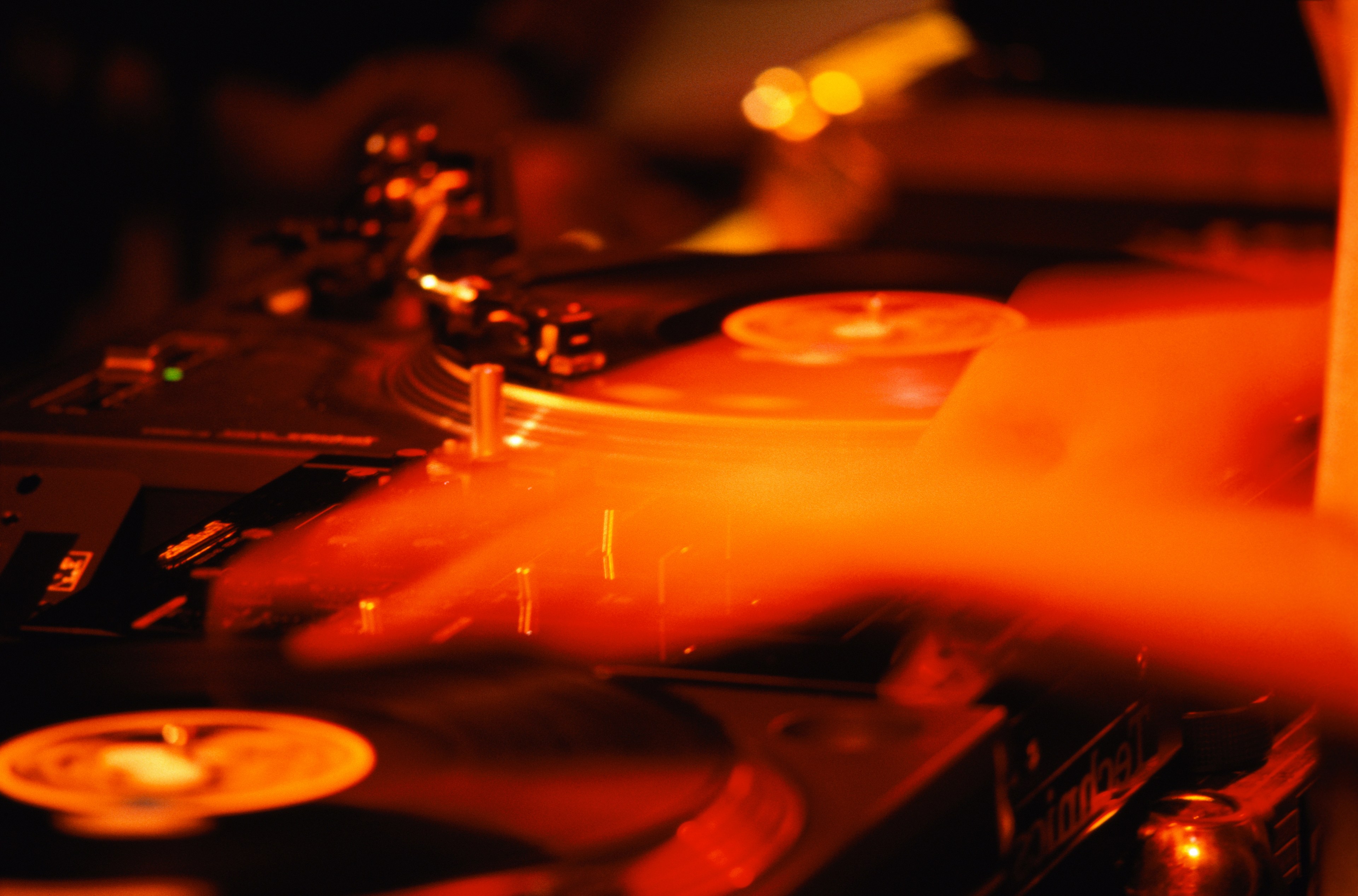 A close up image of a dj spinning music