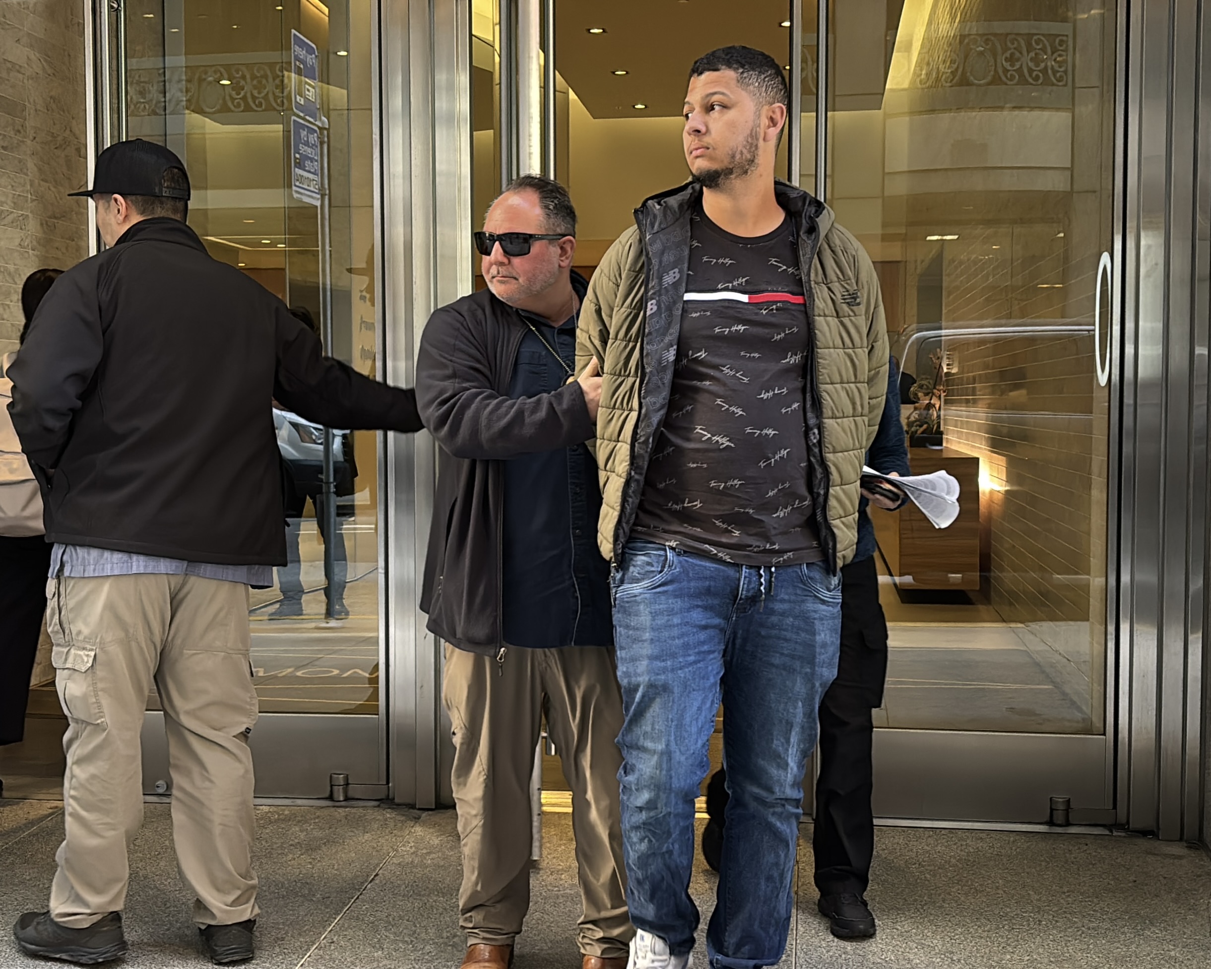 ICE agent detains immigrant